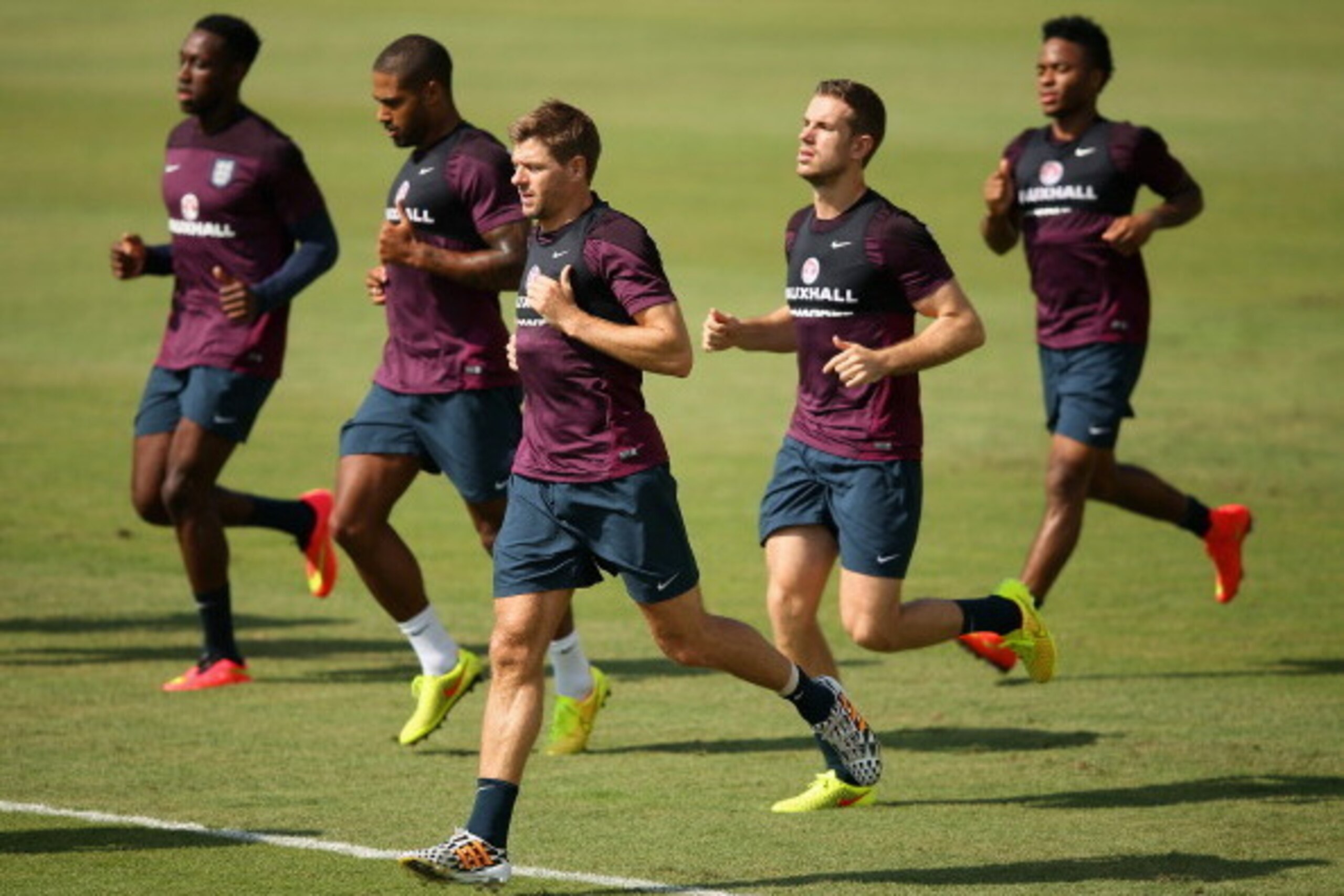 RIO DE JANEIRO, BRAZIL - JUNE 16: (L-R) Danny Welbeck, Glen Johnson, Steven Gerrard, Jordan Henderson and Raheem Sterling of England warm up during a training session at the Urca military base (Forte de Urca) training ground at on June 16, 2014 in Rio de 