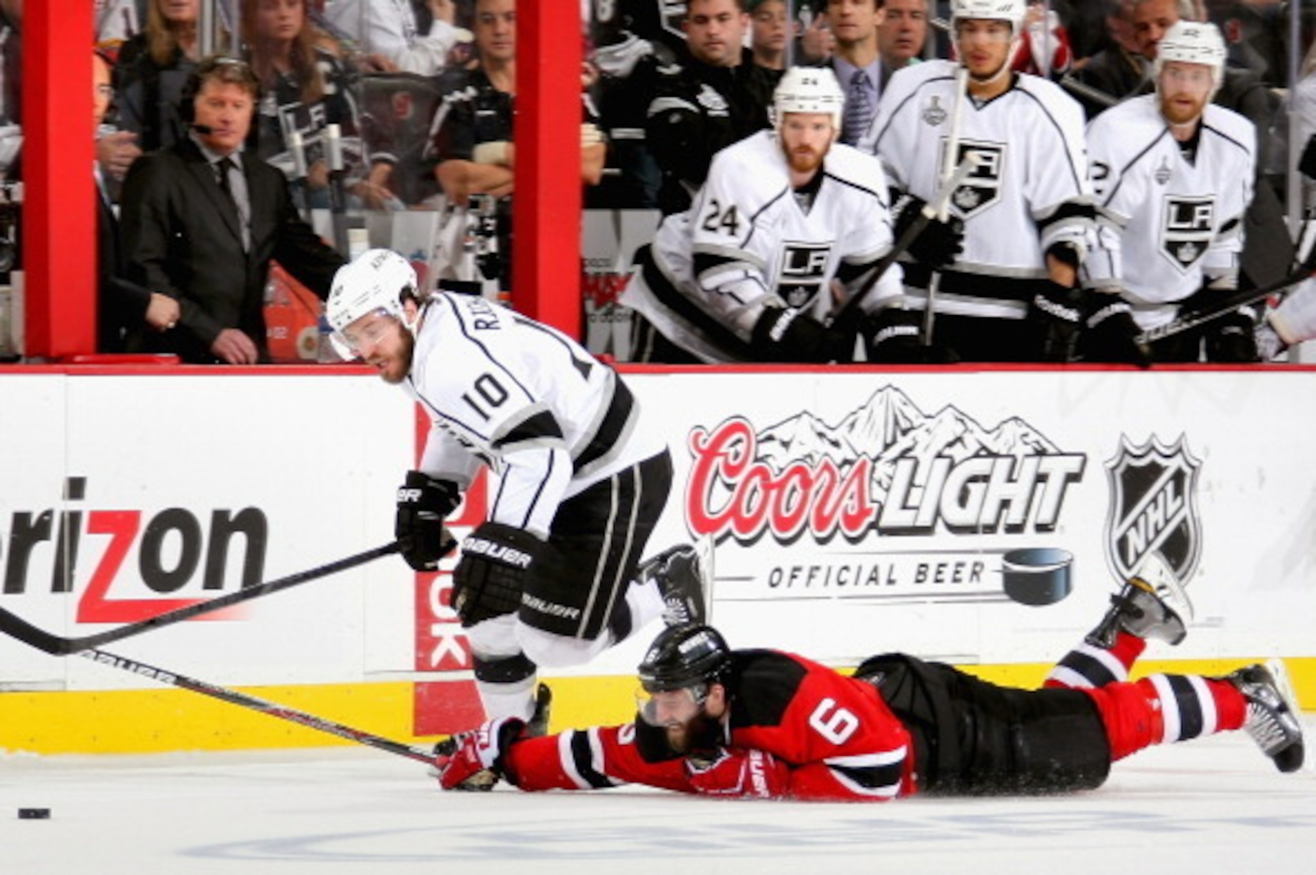 NEWARK, NJ - JUNE 09:  Andy Greene #6 of the New Jersey Devils dives for the loose puck in front of Mike Richards #10 of the Los Angeles Kings during the third period of Game Five of the 2012 Stanley Cup Final at the Prudential Center on June 9, 2012 in N