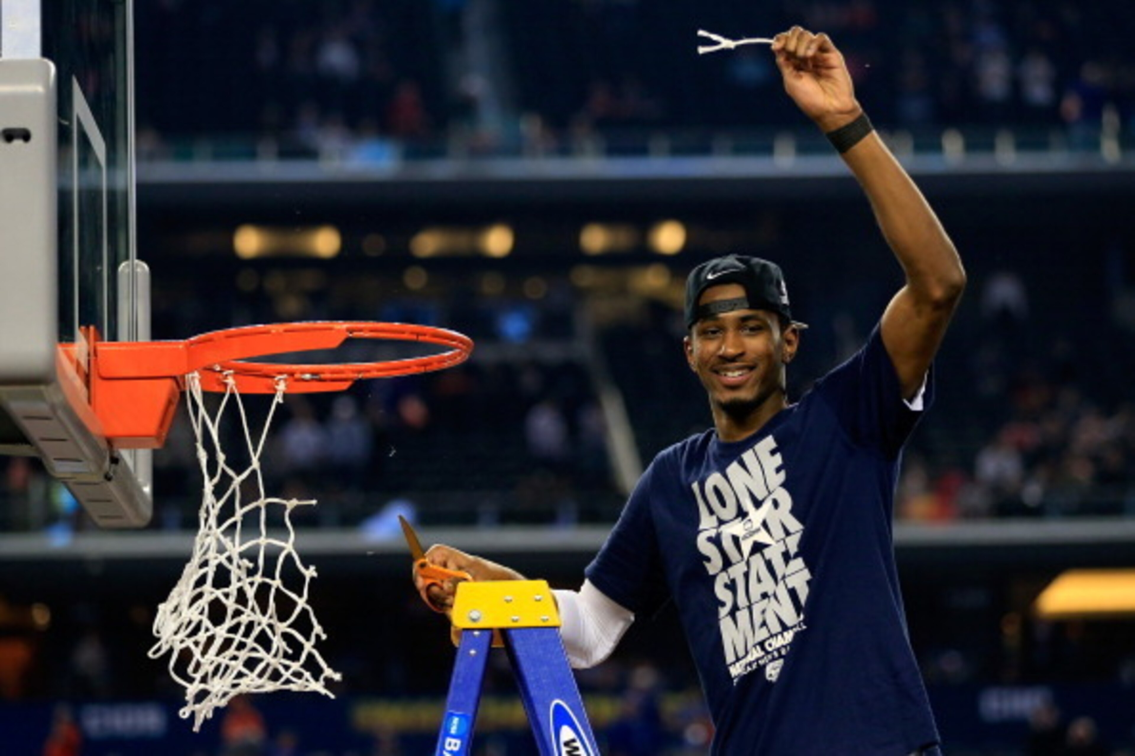 ARLINGTON, TX - APRIL 07:  DeAndre Daniels #2 of the Connecticut Huskies cuts the net after defeating the Kentucky Wildcats 60-54 in the NCAA Men's Final Four Championship at AT&T Stadium on April 7, 2014 in Arlington, Texas.  (Photo by Jamie Squire/Getty