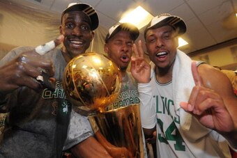 BOSTON - JUNE 17: Kevin Garnett #5, Ray Allen #20 and Paul Pierce #34 of the Boston Celtics pose for a photo with the NBA Champion trophy after defeating the Los Angeles Lakers during Game Six of the NBA Finals at the TD Banknorth Garden on June 17, 2008 