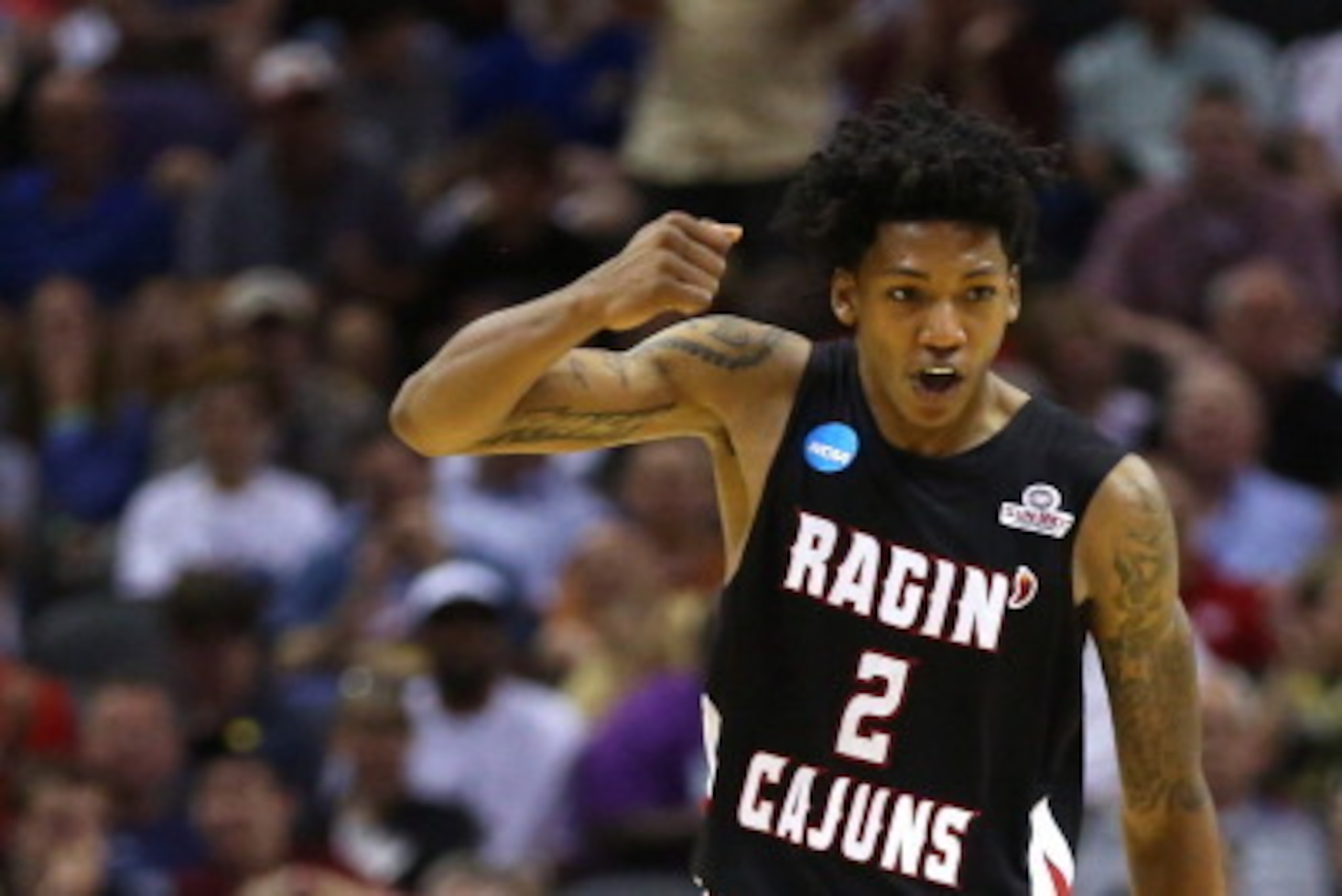 SAN ANTONIO, TX - MARCH 21:  Elfrid Payton #2 of the Louisiana Lafayette Ragin Cajuns celebrates after a play in the second half against the Creighton Bluejays during the second round of the 2014 NCAA Men's Basketball Tournament at AT&T Center on March 21