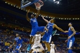 Mar 23, 2014; St. Louis, MO, USA; Kentucky Wildcats forward Julius Randle (30) dunks the ball past Wichita State Shockers center Kadeem Coleby (20) during the second half in the third round of the 2014 NCAA Men's Basketball Championship at Scottrade Cente