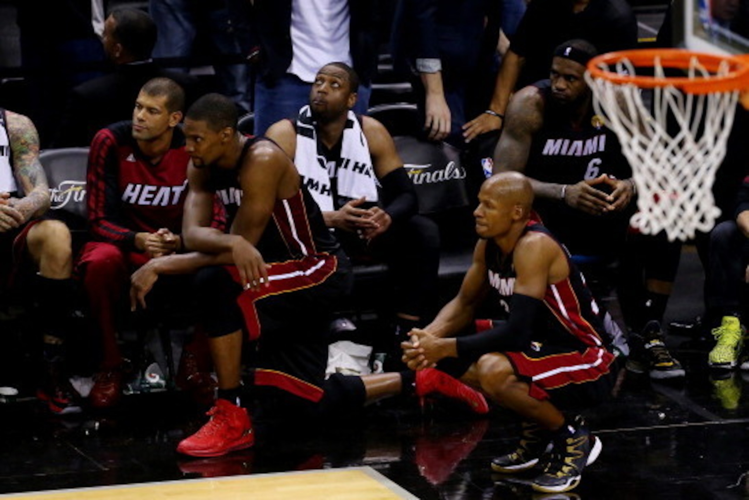 SAN ANTONIO, TX - JUNE 15:  Chris Bosh #1 and Ray Allen #34 of the Miami Heat look on from the bench in the closing minutes against the Miami Heat during Game Five of the 2014 NBA Finals at the AT&T Center on June 15, 2014 in San Antonio, Texas. NOTE TO U