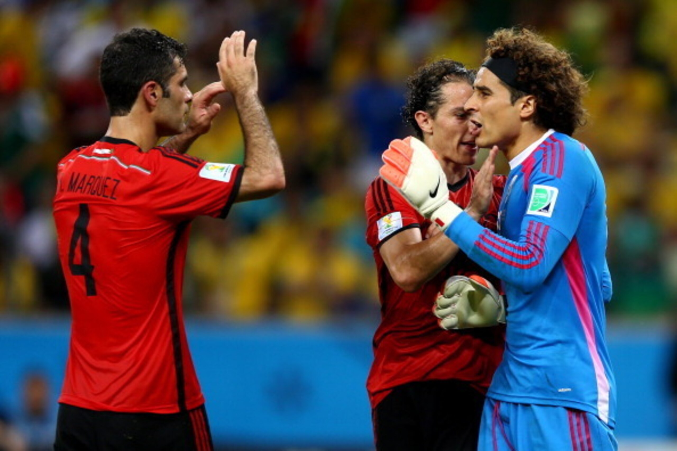 FORTALEZA, BRAZIL - JUNE 17:  Goalkeeper Guillermo Ochoa of Mexico (R) reacts after making a save with Rafael Marquez (L) and Andres Guardado during the 2014 FIFA World Cup Brazil Group A match between Brazil and Mexico at Castelao on June 17, 2014 in For