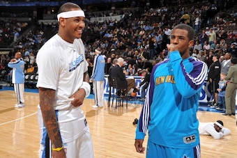 DENVER - JANUARY 23: Carmelo Anthony #15 of the Denver Nuggets talks with Chris Paul #3 of the New Orleans Hornets on January 23, 2010 at the Pepsi Center in Denver, Colorado. NOTE TO USER: User expressly acknowledges and agrees that, by downloading and/o