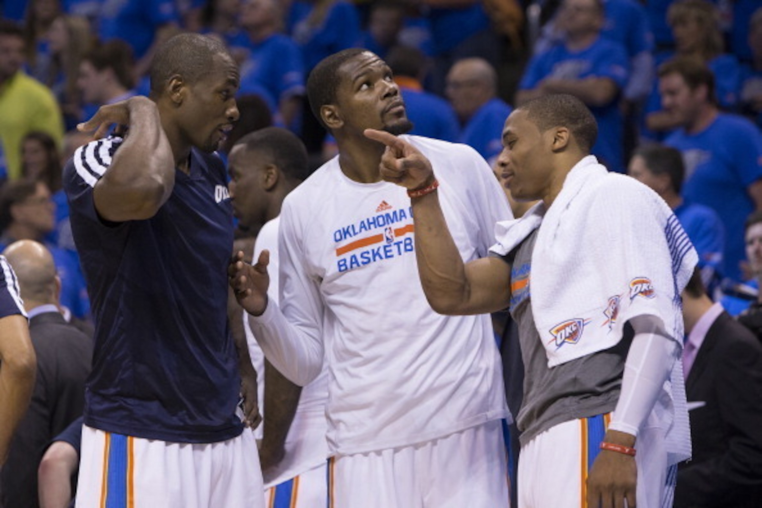 OKLAHOMA CITY, OK - APRIL 19: Serge Ibaka #9, Kevin Durant #35 and Russell Westbrook #0 of the Oklahoma City Thunder talk during the Memphis Grizzlies in Game One of the Western Conference Quarterfinals of the NBA Playoffs at Chesapeake Energy Arena on A OKLAHOMA CITY, OK - APRIL 19: Serge Ibaka #9, Kevin Durant #35 and Russell Westbrook #0 of the Oklahoma City Thunder talk during the Memphis Grizzlies in Game One of the Western Conference Quarterfinals of the NBA Playoffs at Chesapeake Energy Arena on A