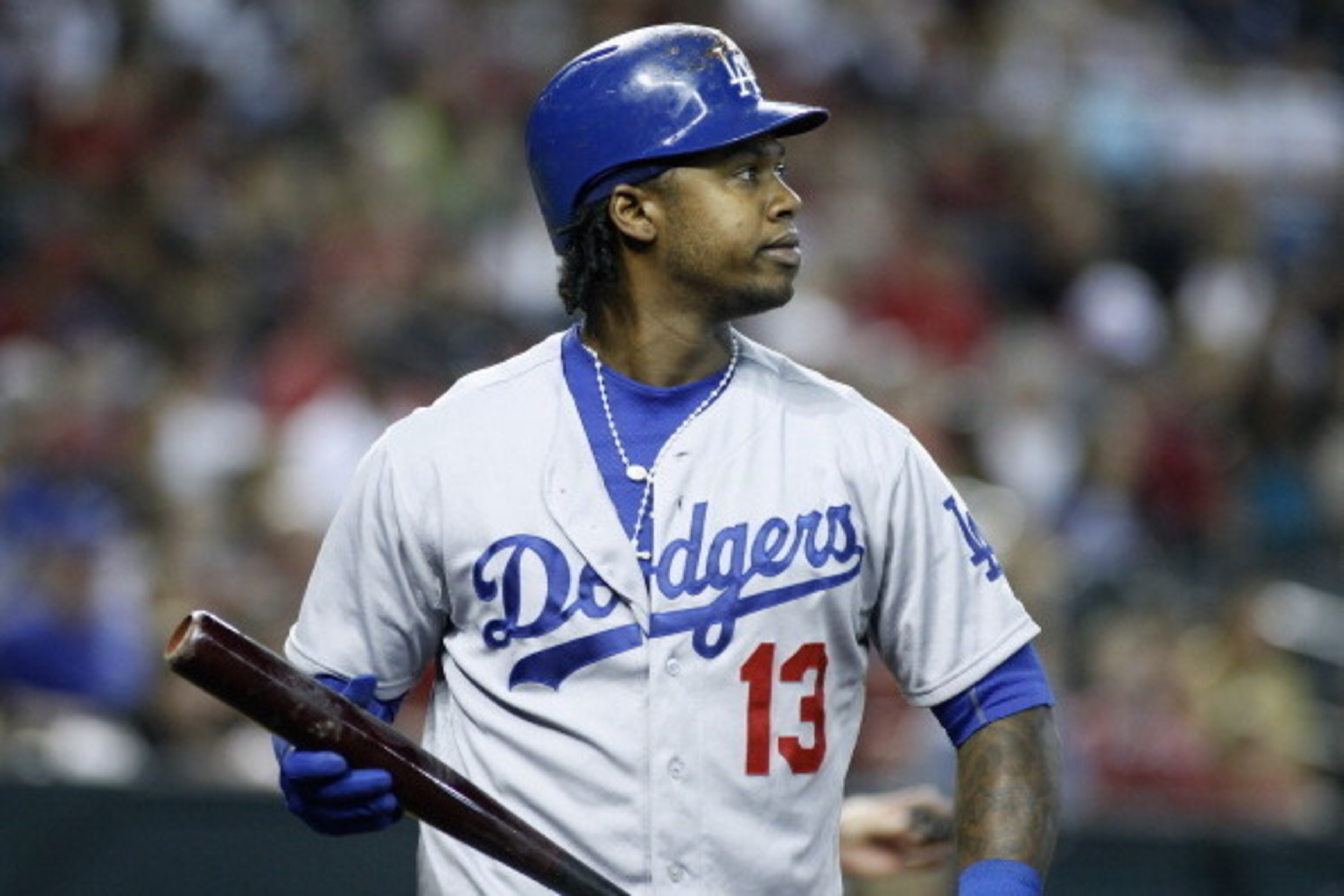 PHOENIX, AZ - MAY 18:  Hanley Ramirez #13 of the Los Angeles Dodgers walks back to the dugout after striking out against the Arizona Diamondbacks during a MLB game at Chase Field on May 18, 2014 in Phoenix, Arizona.  (Photo by Ralph Freso/Getty Images)