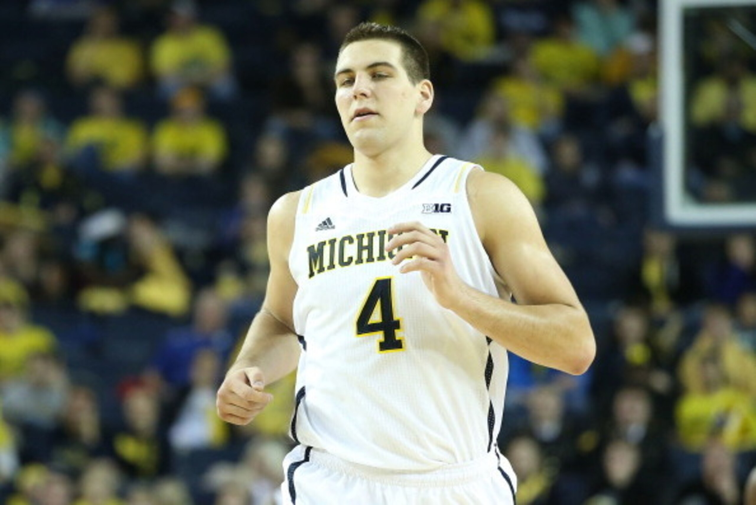 ANN ARBOR, MI - NOVEMBER 29:  Mitch McGary #4 of the Michigan Wolverines runs down the court in his first home game of the season during the second half of the game against Coppin State Eagles at Crisler Center on November 29, 2013 in Ann Arbor, Michigan.