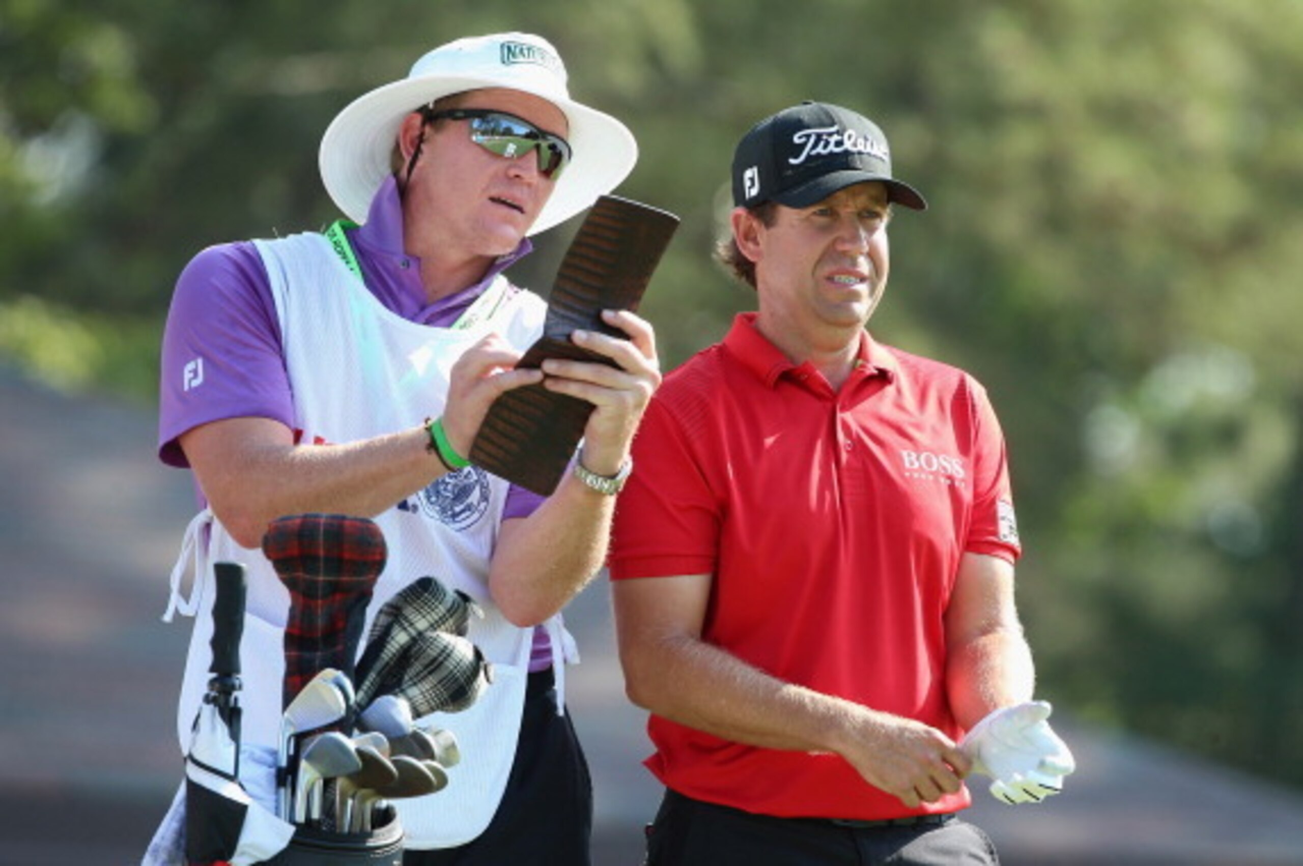 PINEHURST, NC - JUNE 15:  Erik Compton of the United States talks with his caddie Victor Billskoog during the final round of the 114th U.S. Open at Pinehurst Resort & Country Club, Course No. 2 on June 15, 2014 in Pinehurst, North Carolina.  (Photo by And