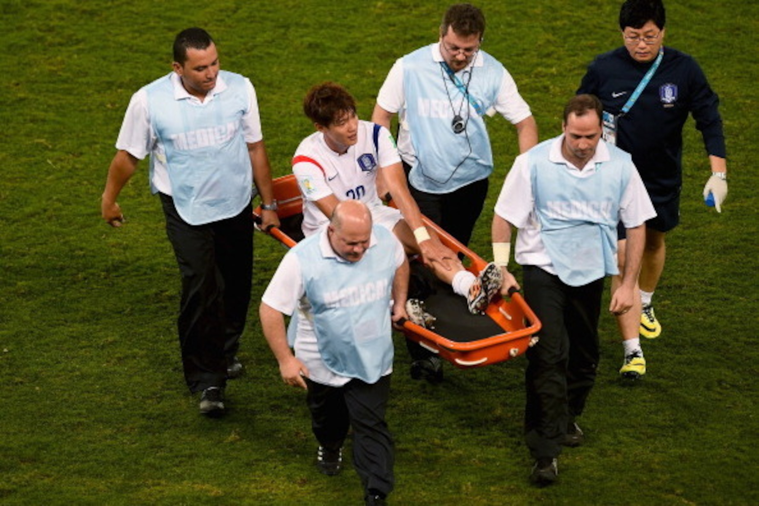 CUIABA, BRAZIL - JUNE 17:  Hong Jeong-Ho of South Korea is stretchered off the field during the 2014 FIFA World Cup Brazil Group H match between Russia and South Korea at Arena Pantanal on June 17, 2014 in Cuiaba, Brazil.  (Photo by Christopher Lee/Getty 