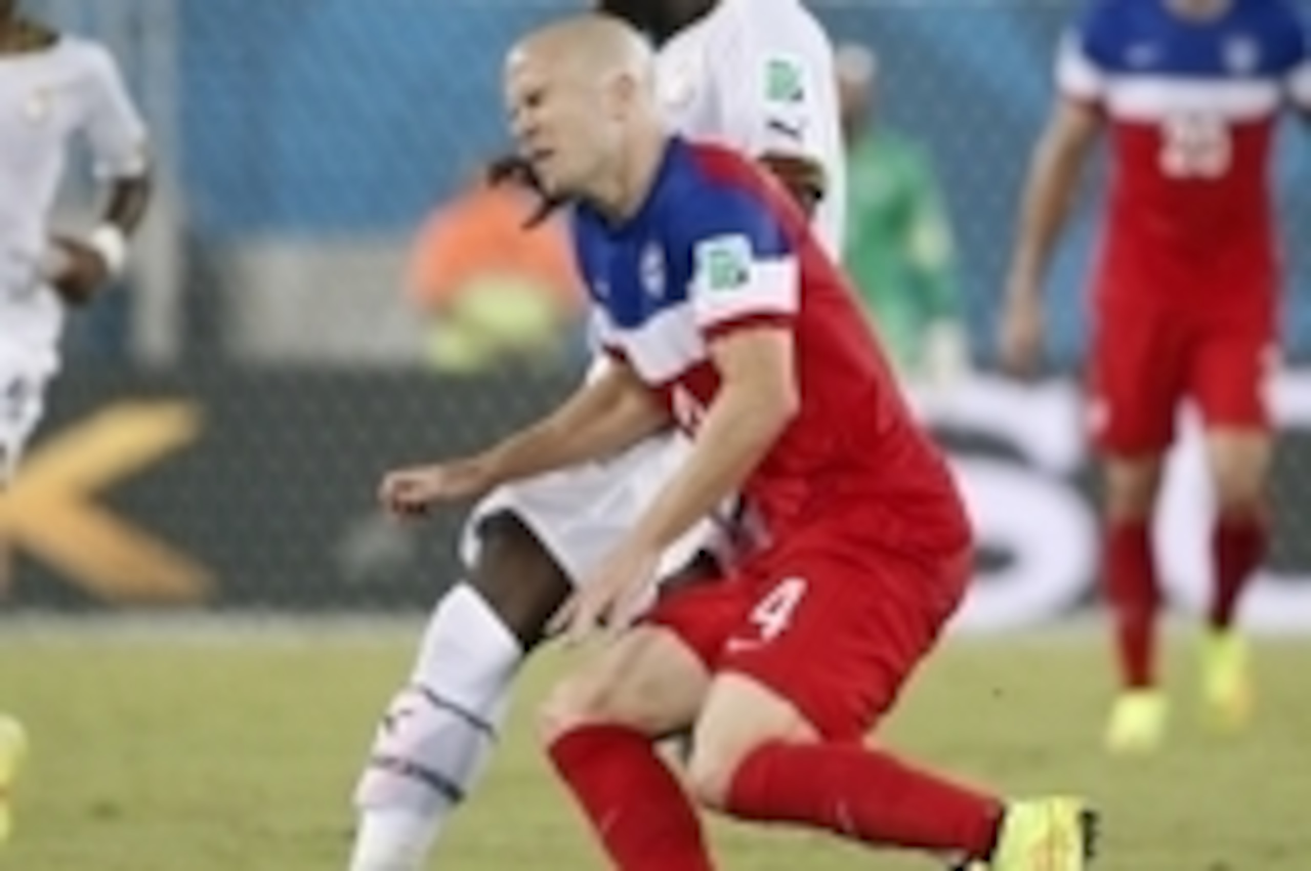 Jun 16, 2014; Natal, Rio Grande do Norte, BRAZIL; United States midfielder Michael Bradley (4) collides with Ghana midfielder Sulley Muntari (11) during the first half of their 2014 World Cup game at Estadio das Dunas. Mandatory Credit: Winslow Townson-US