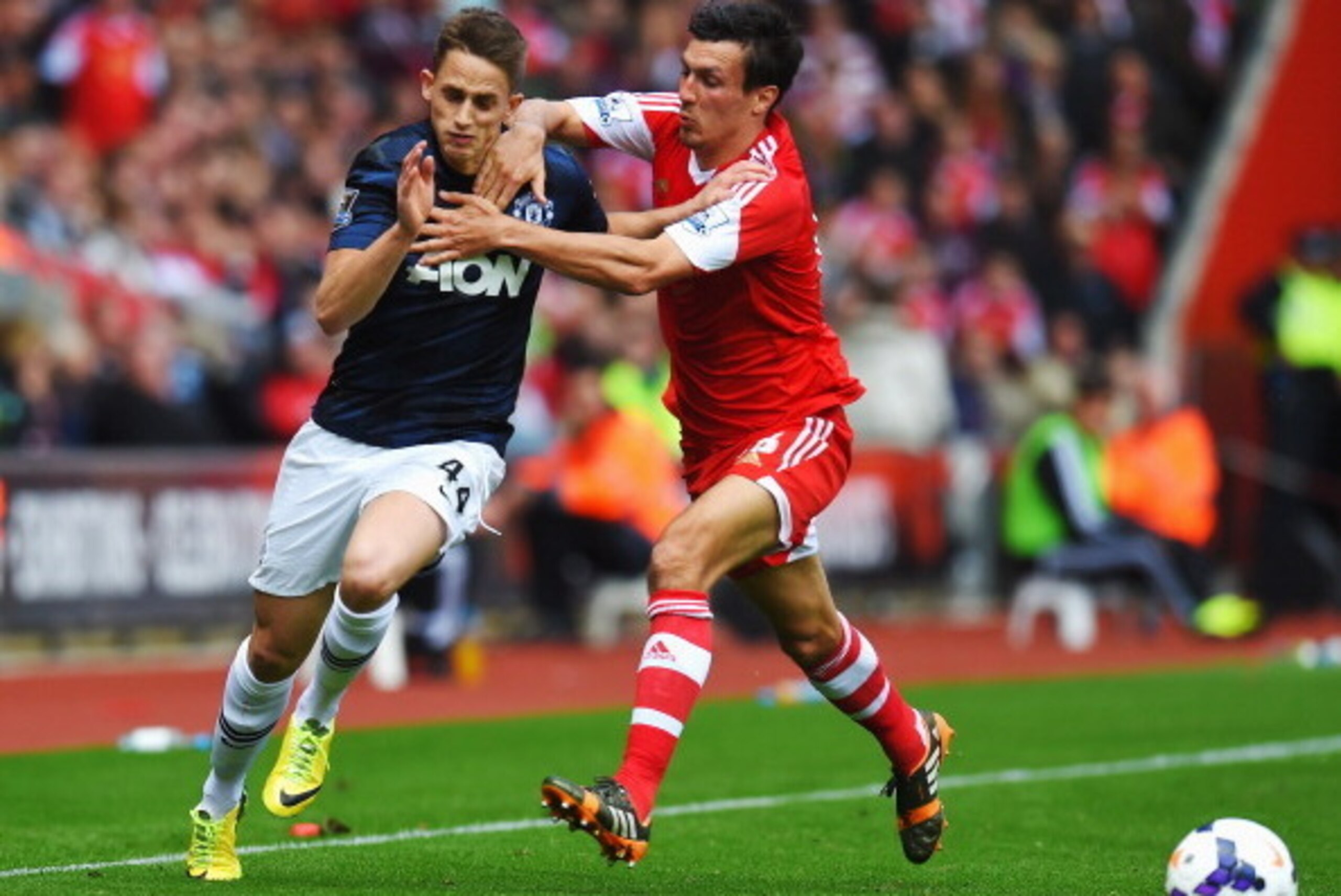SOUTHAMPTON, ENGLAND - MAY 11:  (L-R) Adnan Januzaj of Manchester United is challenged by Jack Cork of Southampton during the Barclays Premier League match between Southampton and Manchester United at St Mary's Stadium on May 11, 2014 in Southampton, Engl