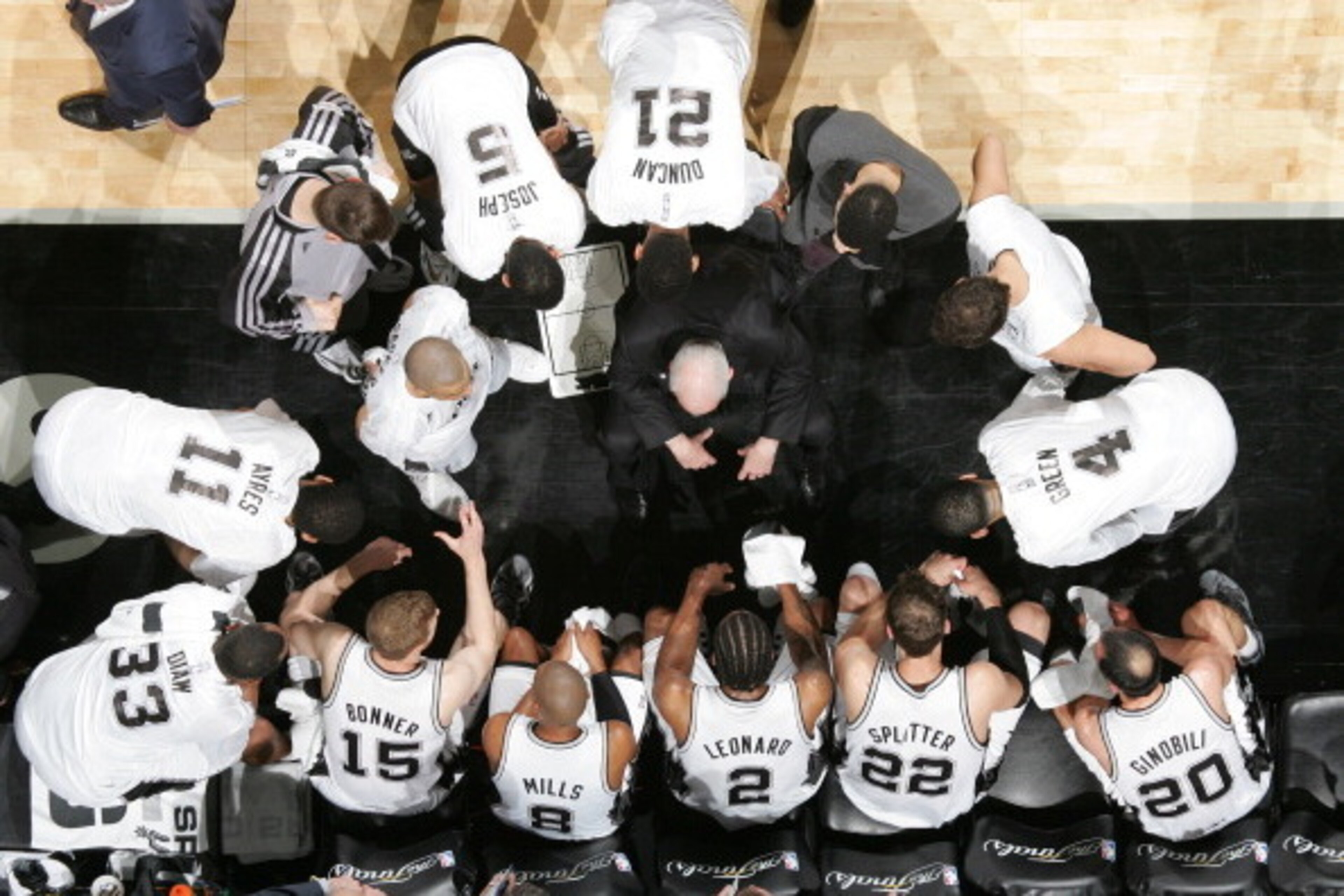 SAN ANTONIO, TX - JUNE 15: San Antonio Spurs players in the huddle during a time out with Head Coach Gregg Popovich during Game Five of the 2014 NBA Finals at AT&T Center on June 15, 2014 in San Antonio, Texas. NOTE TO USER: User expressly acknowledges an