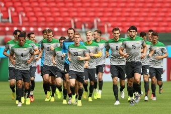 PORTO ALEGRE, BRAZIL - JUNE 17: Socceroo players warm up during an Australian Socceroos training session and press conference at Estadio Beira-Rio on June 17, 2014 in Porto Alegre, Brazil.  (Photo by Cameron Spencer/Getty Images)