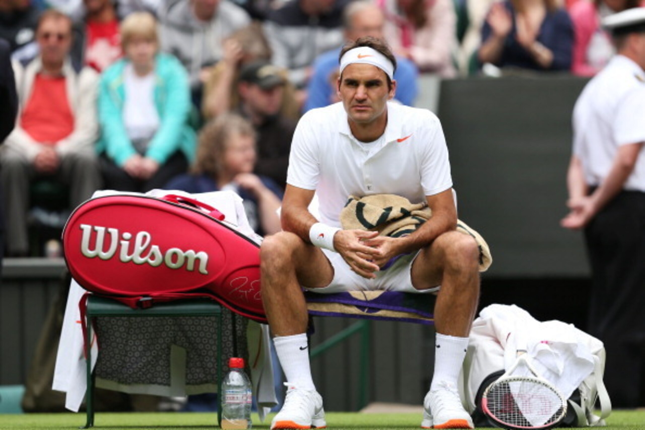 LONDON, ENGLAND - JUNE 24:  Roger Federer of Switzerland takes a break during his gentlemen's singles first round match against Victor Hanescu of Romania on day one of the Wimbledon Lawn Tennis Championships at the All England Lawn Tennis and Croquet Club