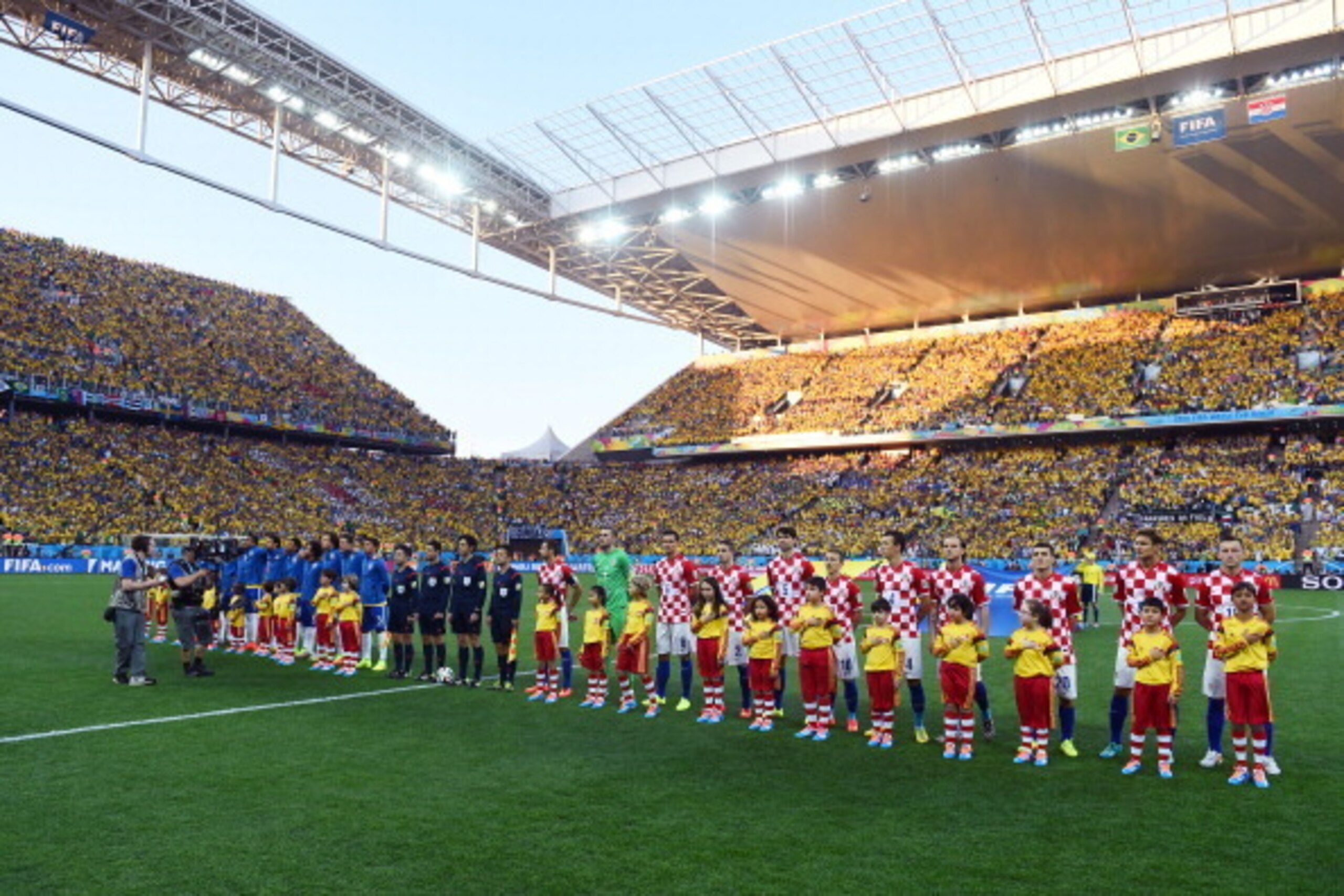 SAO PAULO, BRAZIL - JUNE 12:  Players line on the field before the 2014 FIFA World Cup Brazil Group A match between Brazil and Croatia at Arena de Sao Paulo on June 12, 2014 in Sao Paulo, Brazil.  (Photo by Christopher Lee/Getty Images)