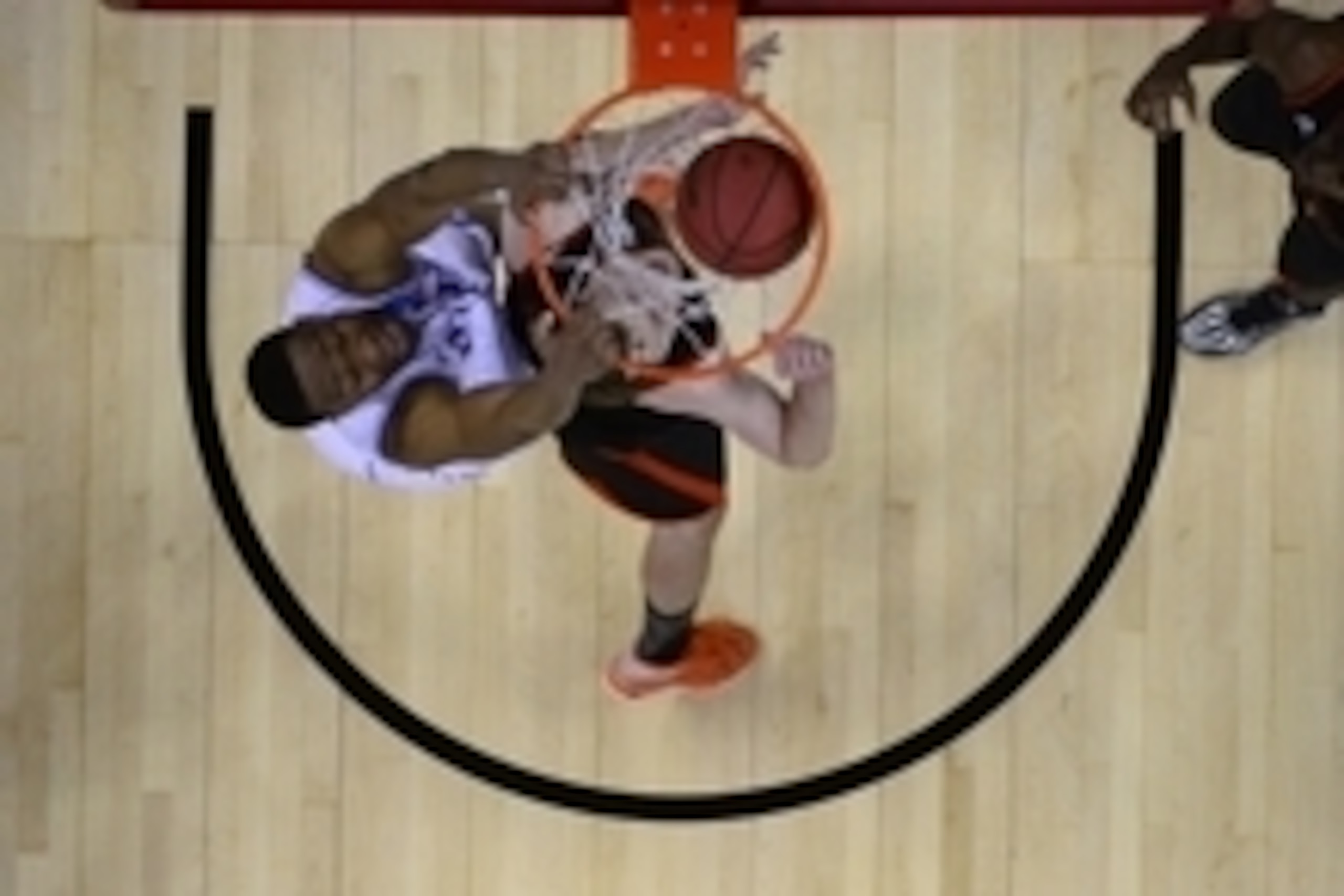 Mar 21, 2014; Raleigh, NC, USA; Duke Blue Devils forward Jabari Parker (1) dunks the ball over Mercer Bears forward Jakob Gollon (20) in the second half of a men's college basketball game during the second round of the 2014 NCAA Tournament at PNC Arena. M