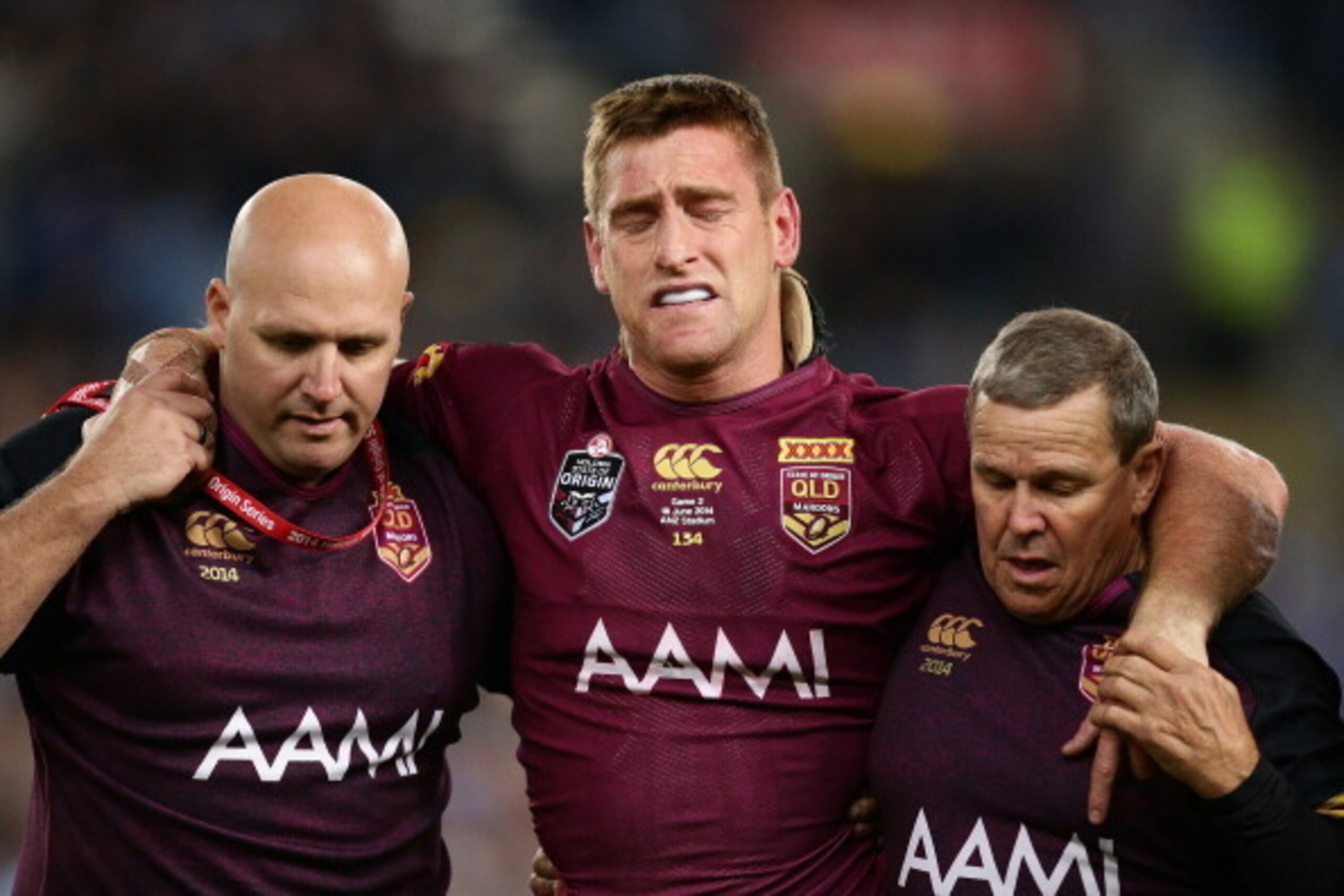 SYDNEY, AUSTRALIA - JUNE 18: Brent Tate of the Maroons is helped off the field after an injury during game two of the State of Origin series between the New South Wales Blues and the Queensland Maroons at ANZ Stadium on June 18, 2014 in Sydney, Australia SYDNEY, AUSTRALIA - JUNE 18: Brent Tate of the Maroons is helped off the field after an injury during game two of the State of Origin series between the New South Wales Blues and the Queensland Maroons at ANZ Stadium on June 18, 2014 in Sydney, Australia