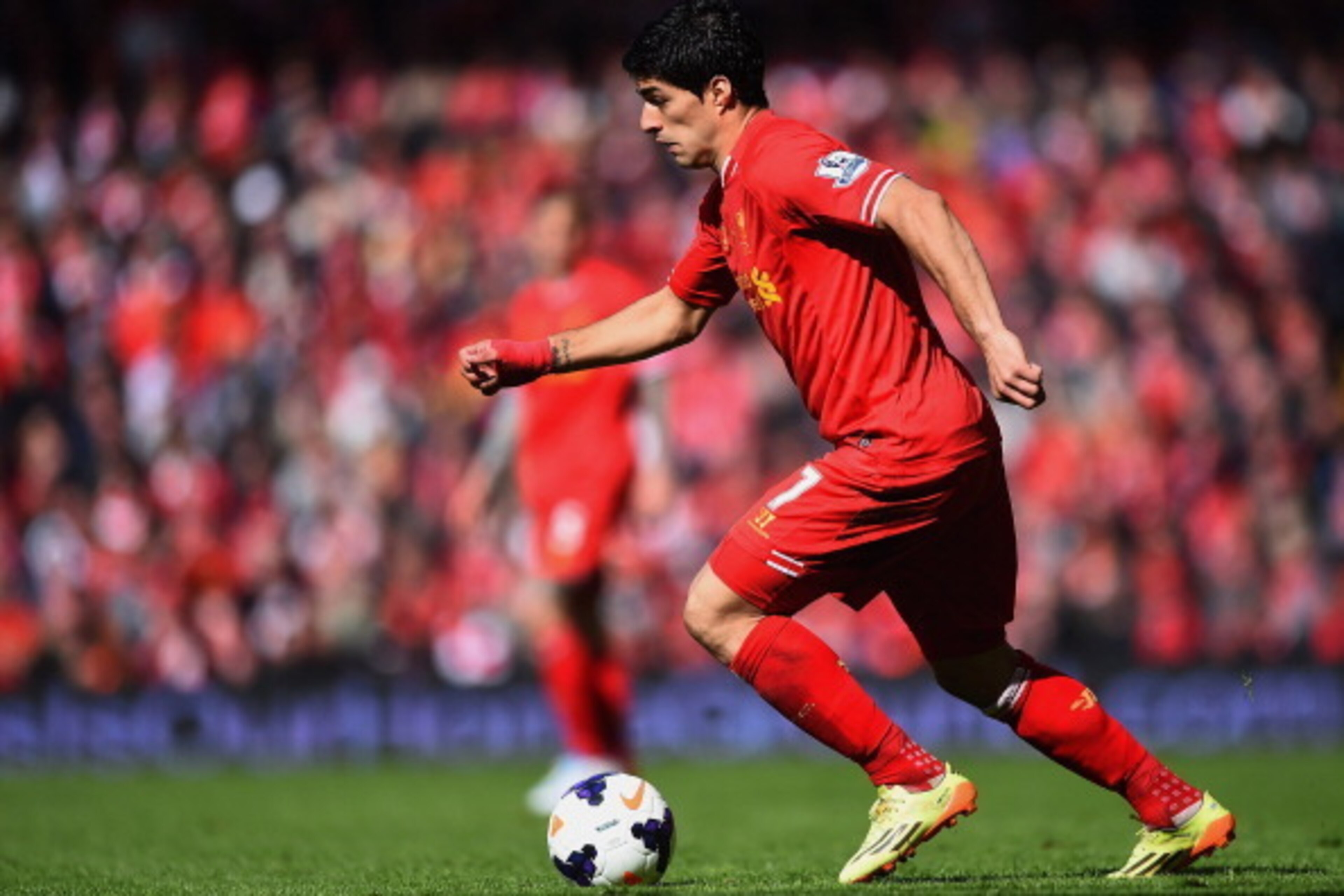 LIVERPOOL, ENGLAND - MAY 11:  Luis Suarez of Liverpool in action during the Barclays Premier League match between Liverpool and Newcastle United at Anfield on May 11, 2014 in Liverpool, England.  (Photo by Laurence Griffiths/Getty Images)