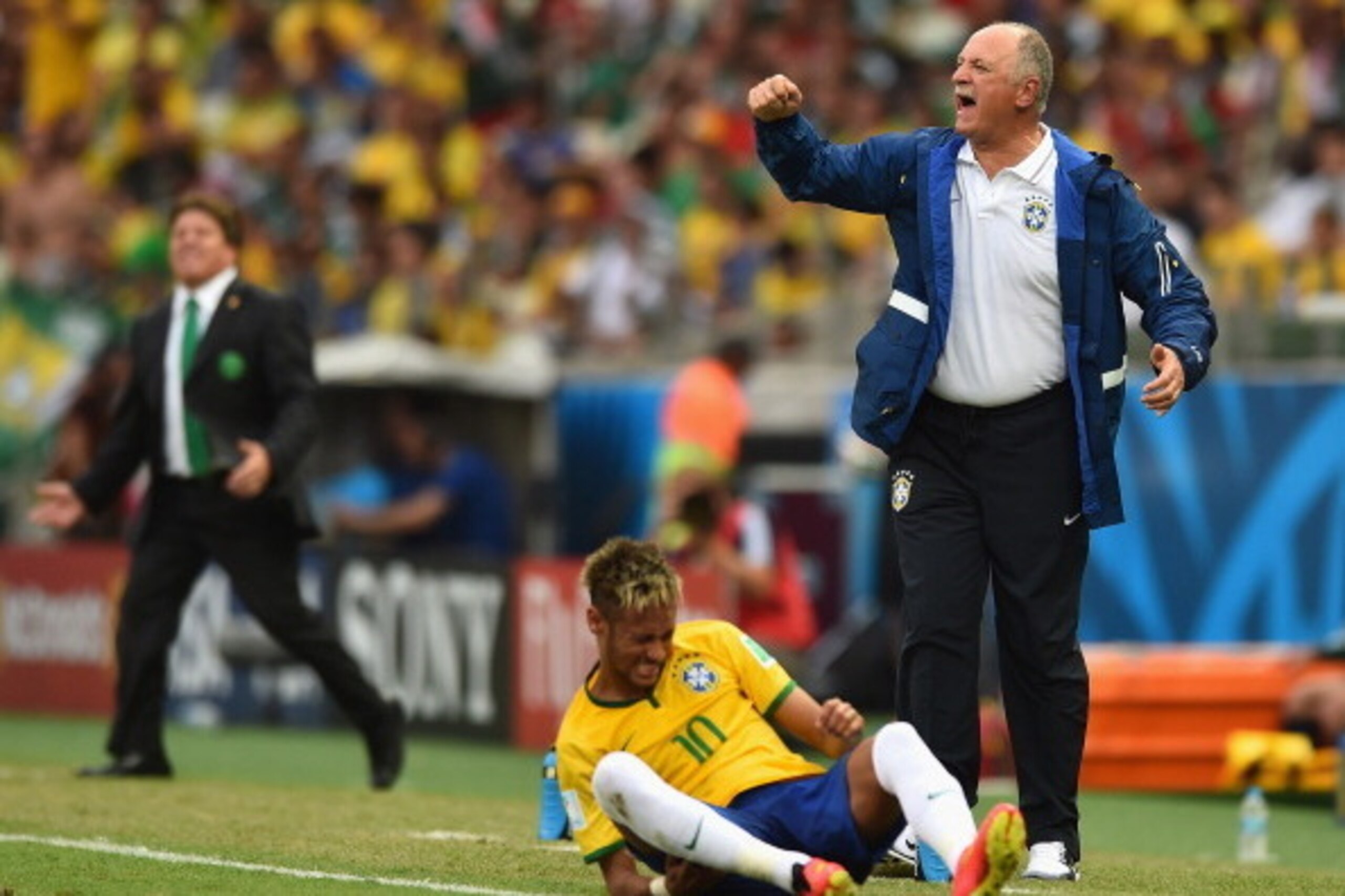 FORTALEZA, BRAZIL - JUNE 17: Head coach Luiz Felipe Scolari of Brazil reacts as Neymar sits on the field during the 2014 FIFA World Cup Brazil Group A match between Brazil and Mexico at Castelao on June 17, 2014 in Fortaleza, Brazil. (Photo by Buda Mend FORTALEZA, BRAZIL - JUNE 17: Head coach Luiz Felipe Scolari of Brazil reacts as Neymar sits on the field during the 2014 FIFA World Cup Brazil Group A match between Brazil and Mexico at Castelao on June 17, 2014 in Fortaleza, Brazil. (Photo by Buda Mend