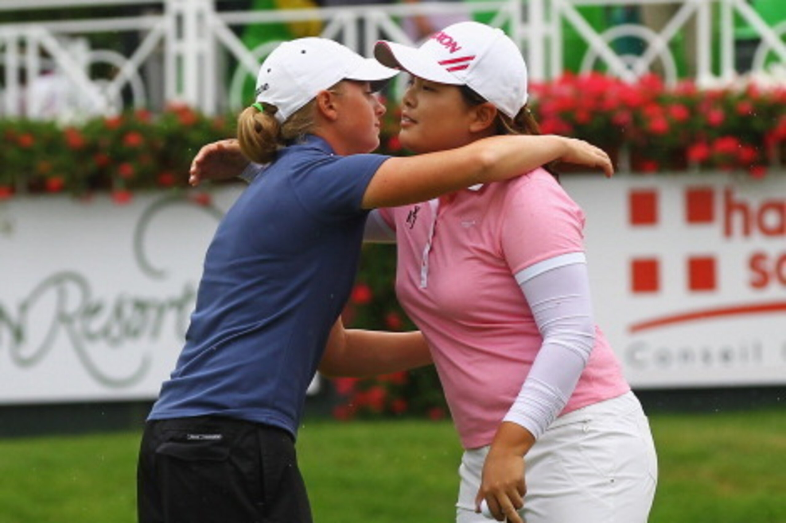 EVIAN-LES-BAINS, FRANCE - JULY 28:  Stacy Lewis of the United States of America and Inbee Park of South Korea congraulate each other after day three of the Evian Masters at the Evian Masters Golf Club on July 28, 2012 in Evian-les-Bains, France.  (Photo b