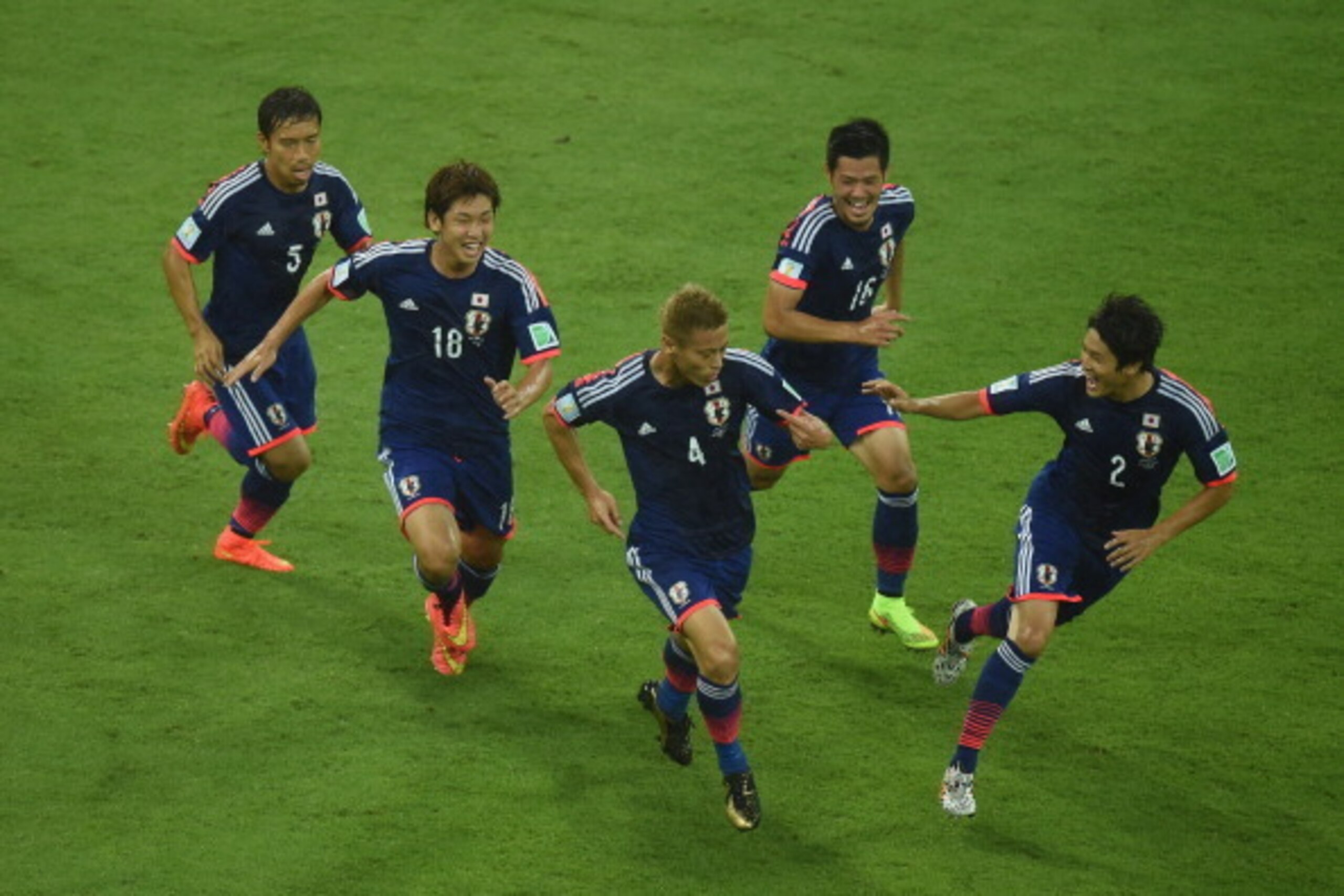 RECIFE, BRAZIL - JUNE 14:  Keisuke Honda of Japan celebrates scoring his team's first goal during the 2014 FIFA World Cup Brazil Group C match  between the Ivory Coast and Japan at Arena Pernambuco on June 14, 2014 in Recife, Brazil.  (Photo by Matthias H