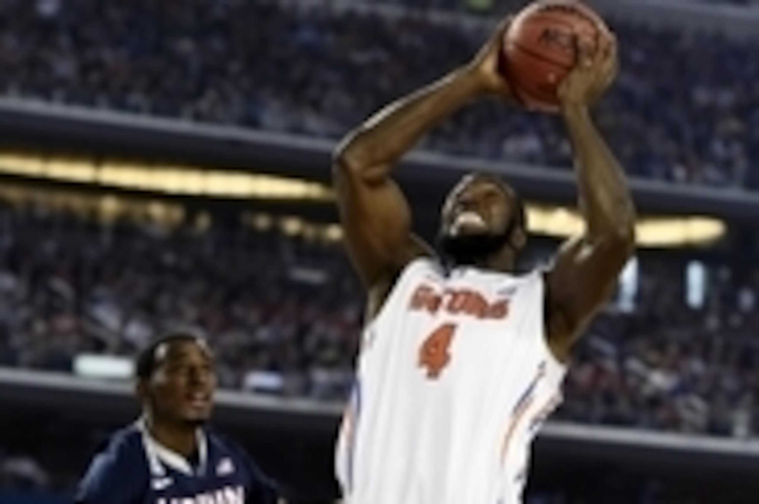 Apr 5, 2014; Arlington, TX, USA; Florida Gators center Patric Young (4) goes up for a shot against Connecticut Huskies forward DeAndre Daniels (2) in the second half during the semifinals of the Final Four in the 2014 NCAA Mens Division I Championship tou