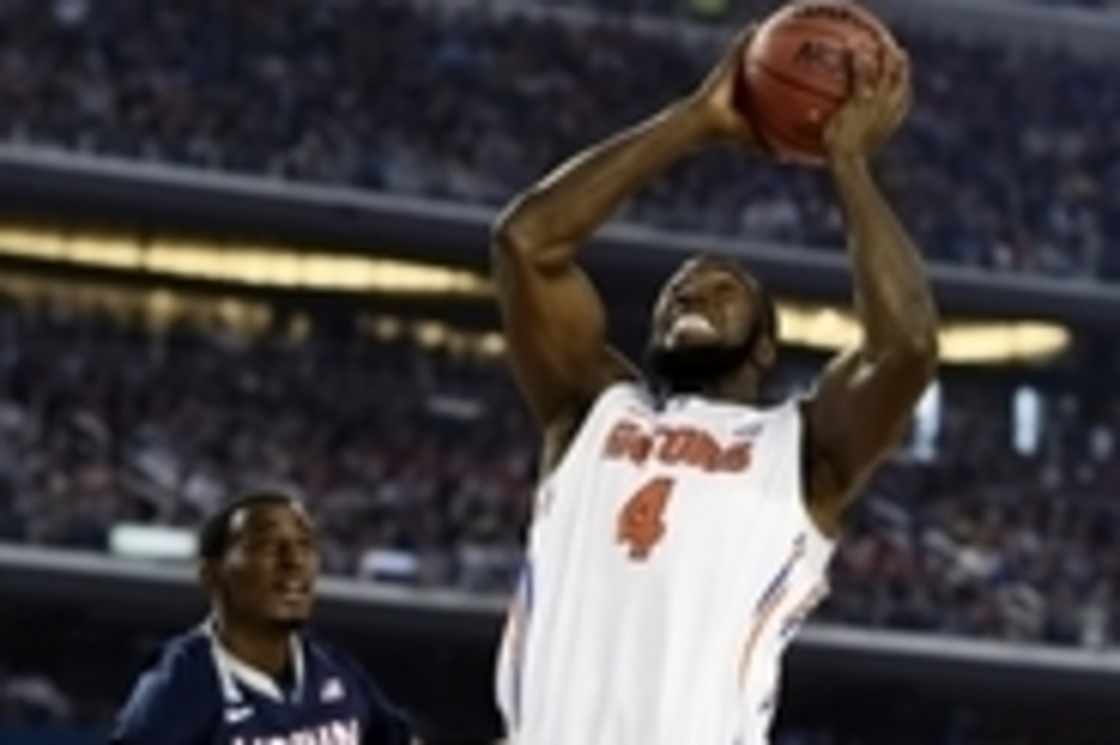 Apr 5, 2014; Arlington, TX, USA; Florida Gators center Patric Young (4) goes up for a shot against Connecticut Huskies forward DeAndre Daniels (2) in the second half during the semifinals of the Final Four in the 2014 NCAA Mens Division I Championship tou