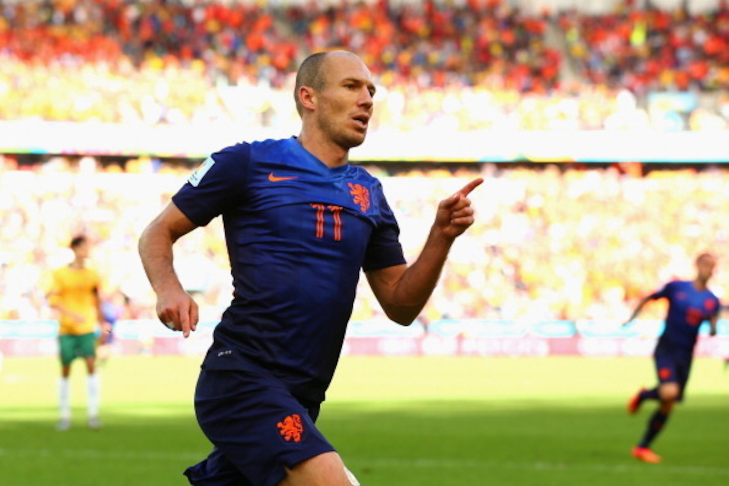 PORTO ALEGRE, BRAZIL - JUNE 18:  Arjen Robben of the Netherlands celebrates after scoring his team's first goal during the 2014 FIFA World Cup Brazil Group B match between Australia and Netherlands at Estadio Beira-Rio on June 18, 2014 in Porto Alegre, Br
