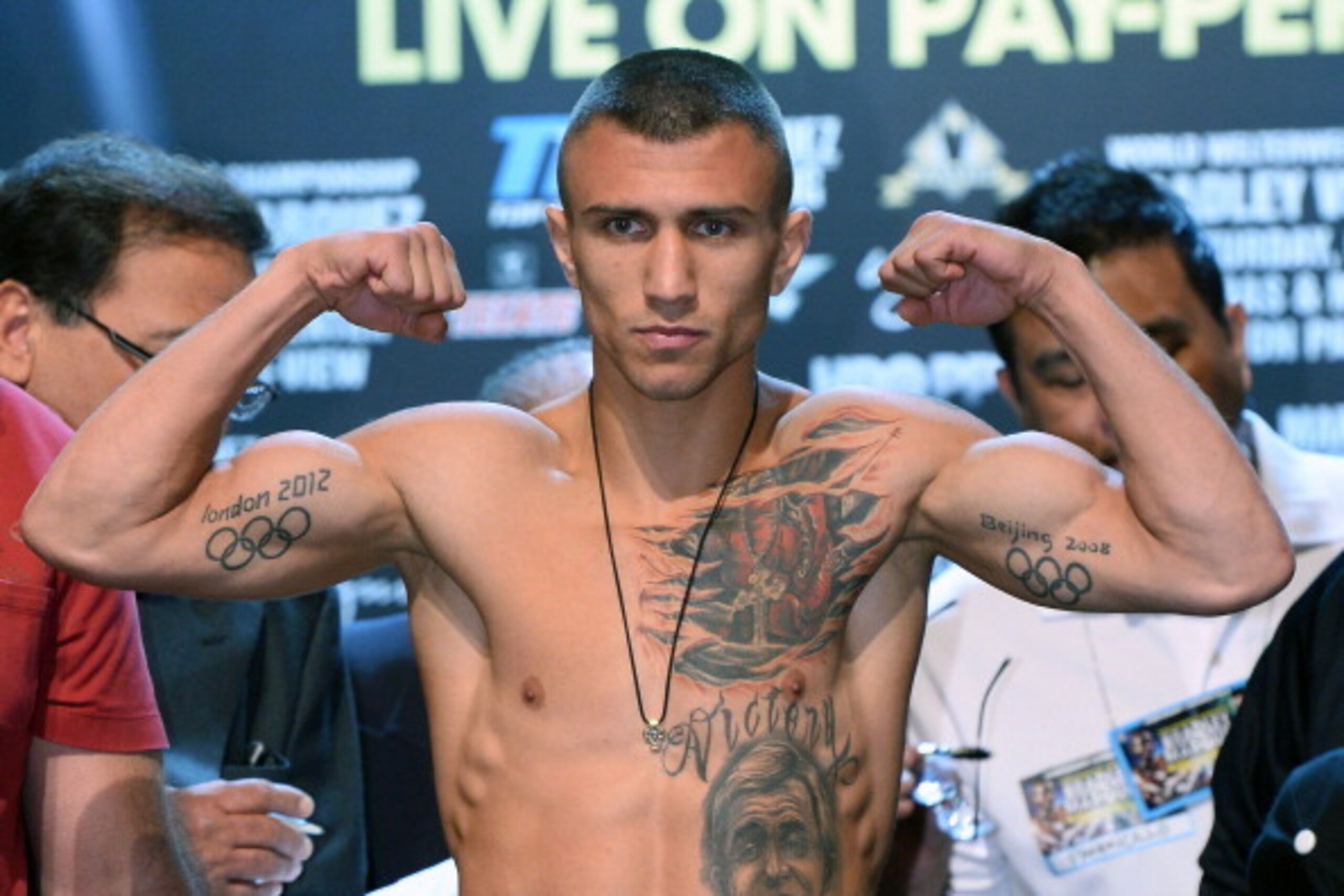 LAS VEGAS, NV - OCTOBER 11:  Boxer Vasyl Lomachenko poses on the scale during the official weigh-in for his bout against Jose Ramirez at the Encore Theater at Wynn Las Vegas on October 11, 2013 in Las Vegas, Nevada. Lomachenko and Ramirez will meet in a f