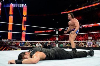 Rusev in control of Reigns on Raw.