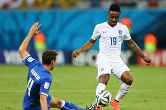 MANAUS, BRAZIL - JUNE 14:  Matteo Darmian of Italy tackles Raheem Sterling of England during the 2014 FIFA World Cup Brazil Group D match between England and Italy at Arena Amazonia on June 14, 2014 in Manaus, Brazil.  (Photo by Elsa/Getty Images)