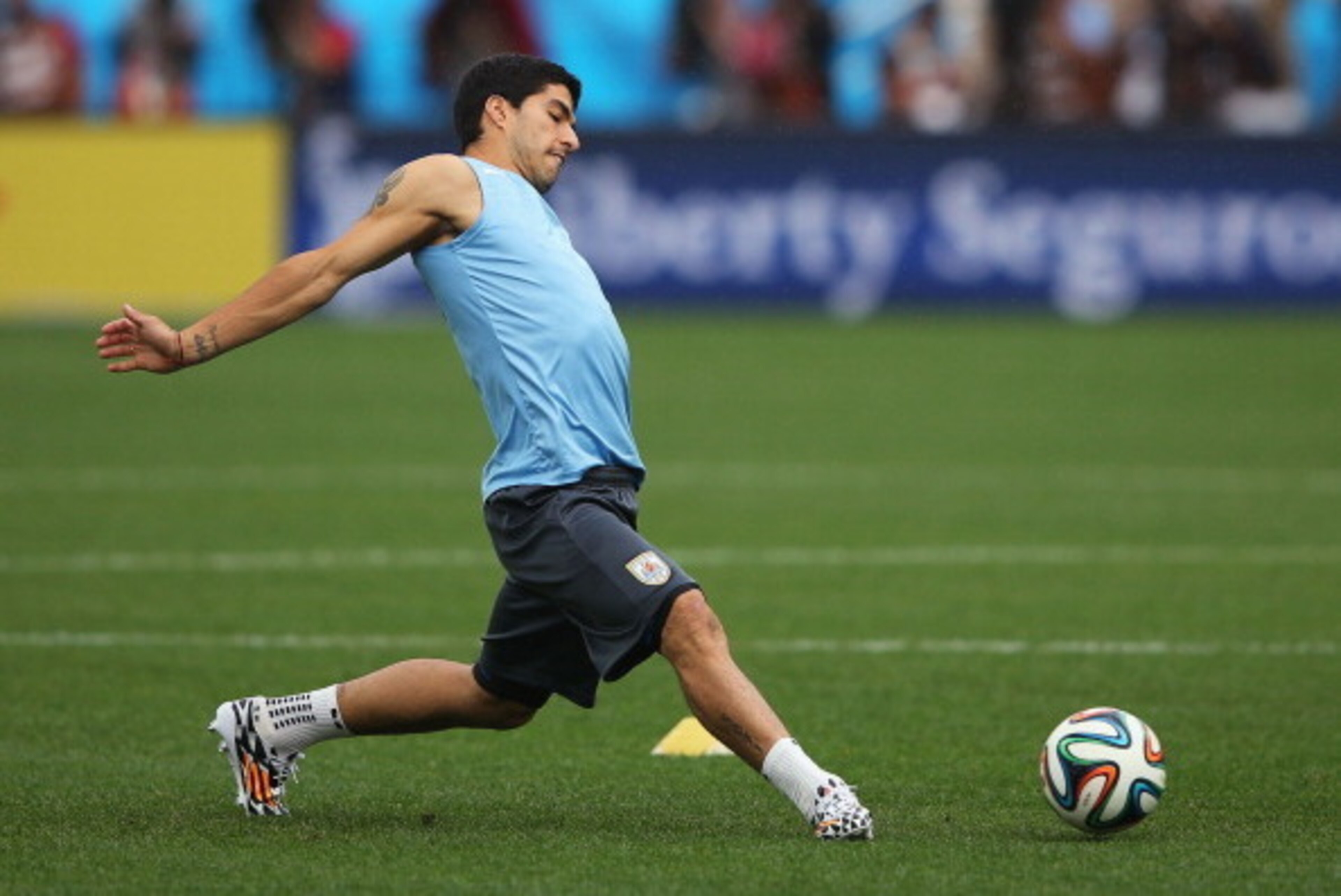 SAO PAULO, BRAZIL - JUNE 18:  Luis Suarez of Uruguay in action during a Uruguay training session ahead of the 2014 FIFA World Cup Brazil match against England at Arena de Sao Paulo on June 18, 2014 in Sao Paulo, Brazil.  (Photo by Richard Heathcote/Getty 