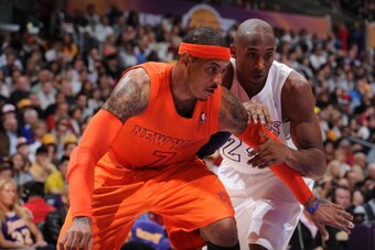 LOS ANGELES, CA - DECEMBER 25: Carmelo Anthony #7 of the New York Knicks and Kobe Bryant #24 of the Los Angeles Lakers battle for positioning at Staples Center on December 25, 2012 in Los Angeles, California. NOTE TO USER: User expressly acknowledges and 