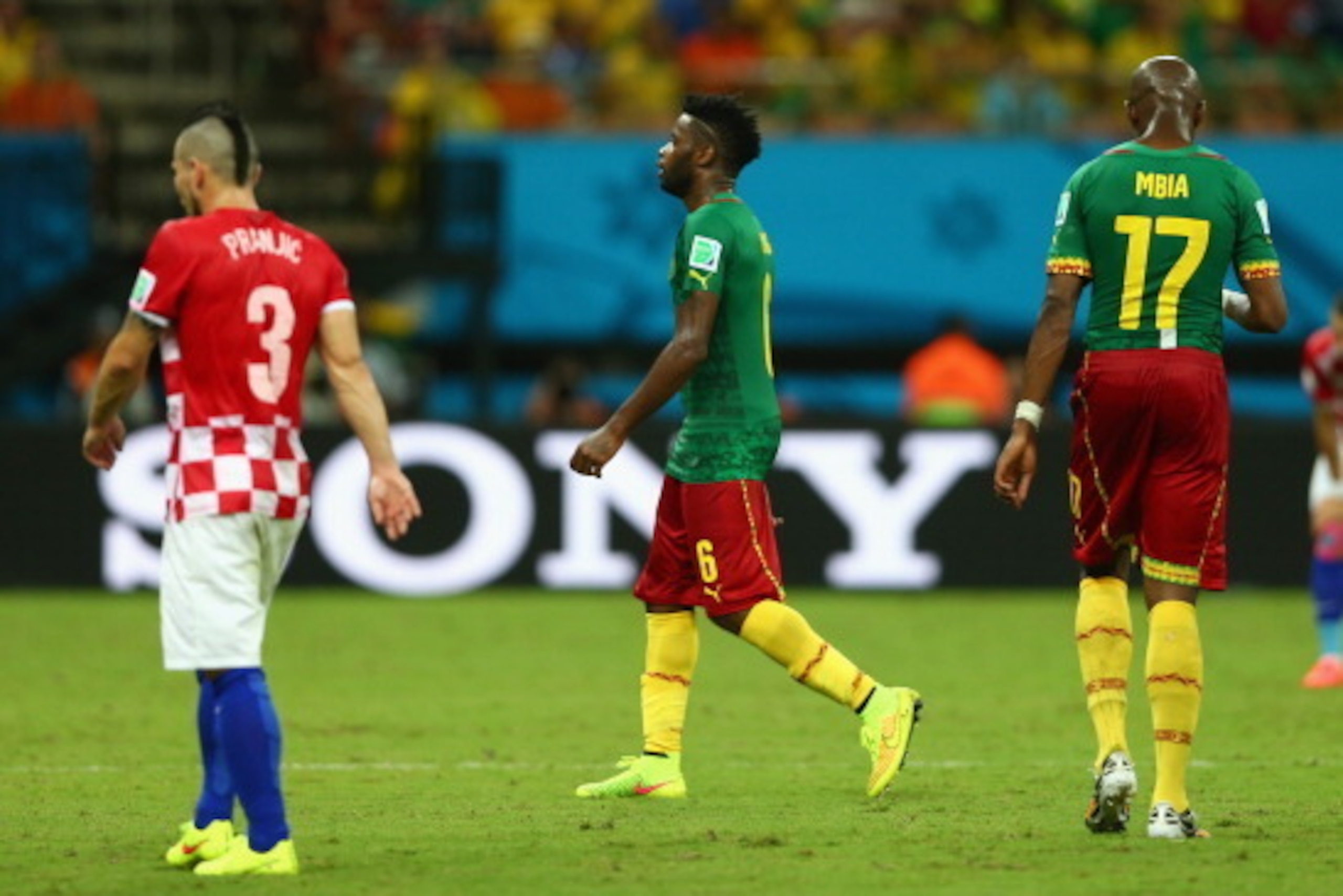 MANAUS, BRAZIL - JUNE 18:  Alex Song of Cameroon walks off the field after receiving a red card during the 2014 FIFA World Cup Brazil Group A match between Cameroon and Croatia at Arena Amazonia on June 18, 2014 in Manaus, Brazil.  (Photo by Clive Brunski