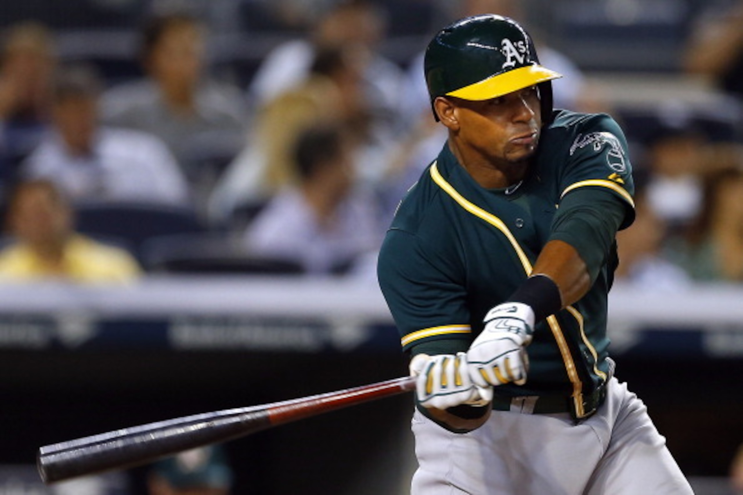 NEW YORK, NY - JUNE 4: Yoenis Cespedes #52 of the Oakland Athletics hits a home run against the New York Yankees during the sixth inning in a MLB baseball game at Yankee Stadium on June 4, 2014 in the Bronx borough of New York City. (Photo by Rich Schultz