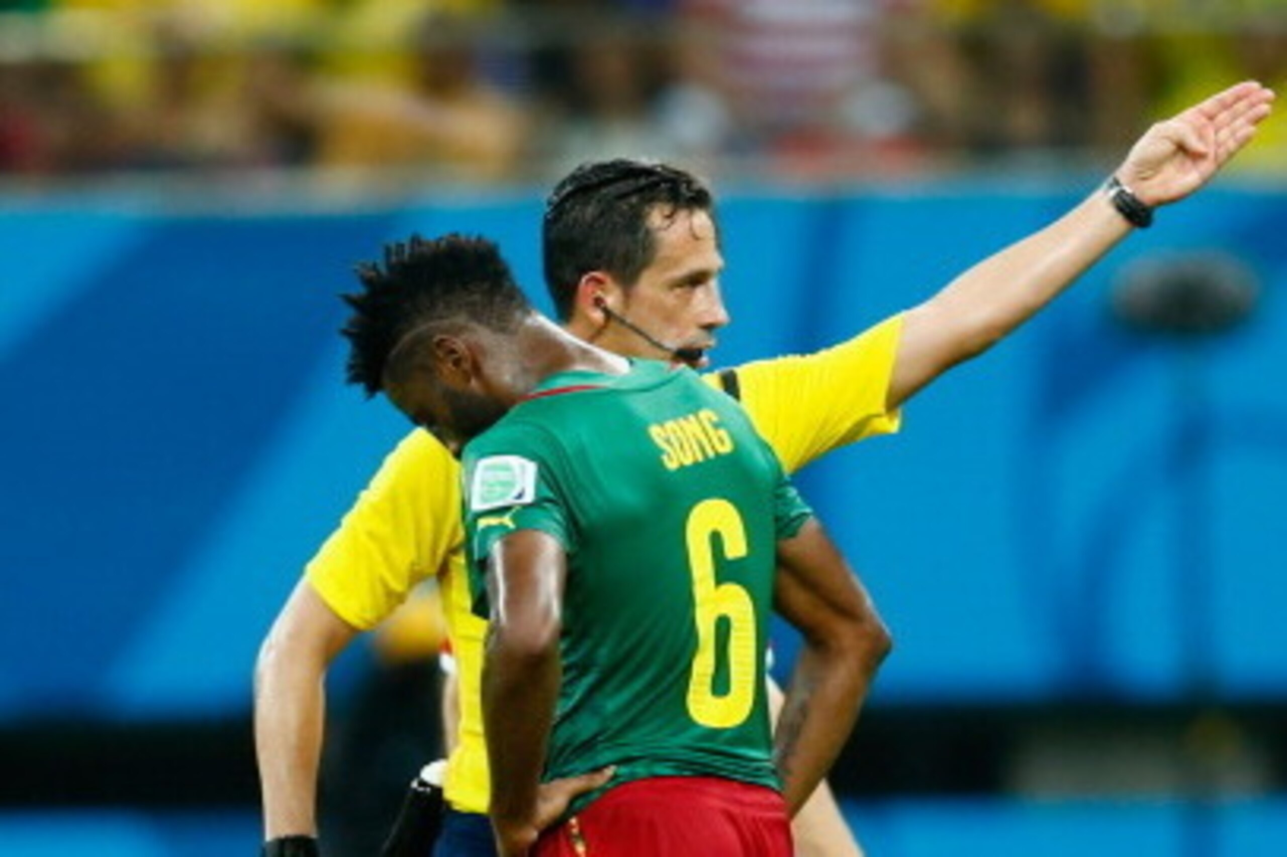 MANAUS, BRAZIL - JUNE 18:  Alex Song of Cameroon is shown a red card by referee Pedro Proenca during the 2014 FIFA World Cup Brazil Group A match between Cameroon and Croatia at Arena Amazonia on June 18, 2014 in Manaus, Brazil.  (Photo by Phil Walter/Get