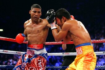 LAS VEGAS, NV - DECEMBER 08:  (L-R) Yuriorkis Gamboa throws a left at Michael Farenas during their super featherweight bout at the MGM Grand Garden Arena on December 8, 2012 in Las Vegas, Nevada.  (Photo by Al Bello/Getty Images)