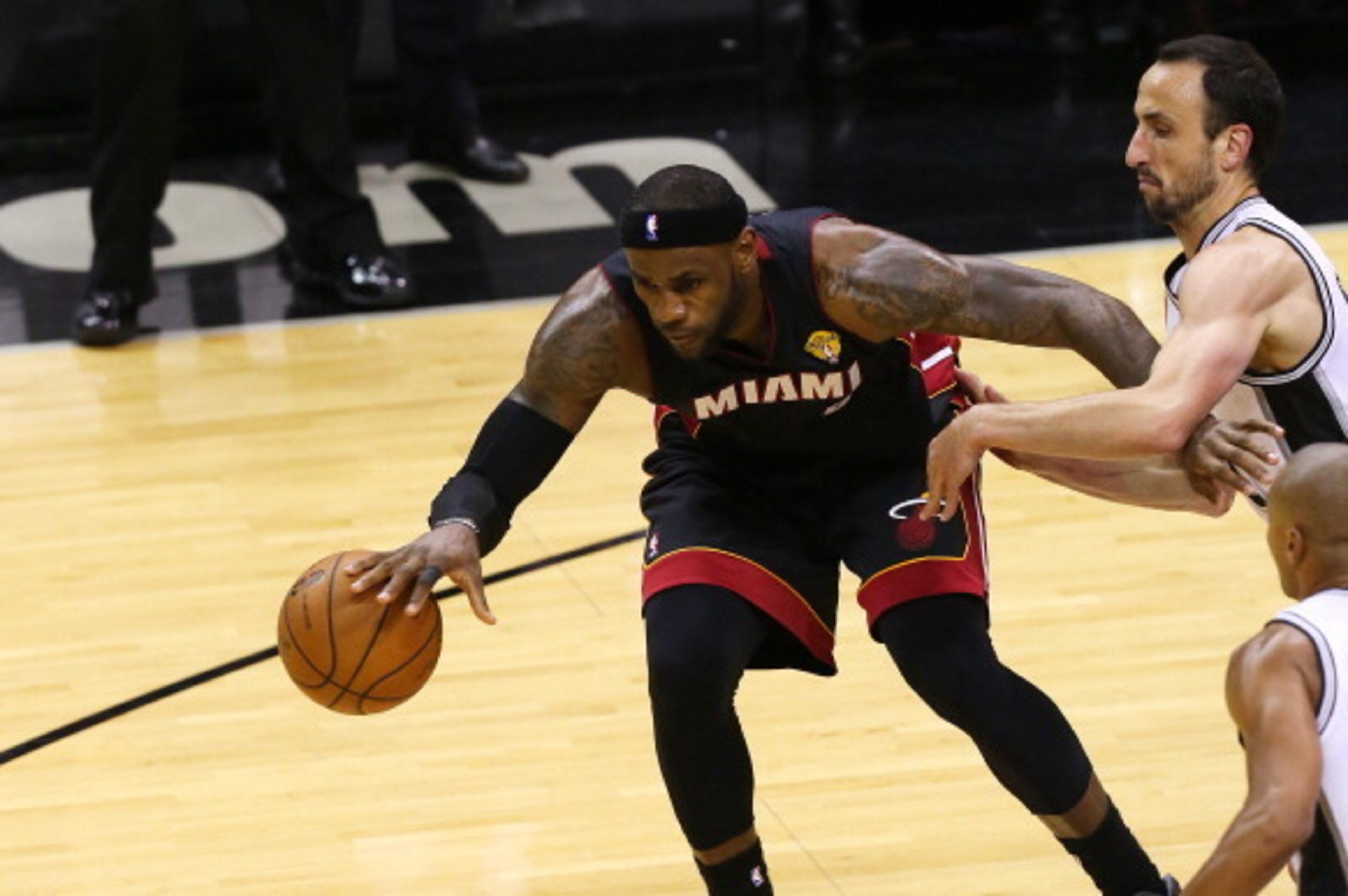 SAN ANTONIO, TX - JUNE 15: LeBron James #6 of the Miami Heat keeps the ball away from Manu Ginobili #20 of the San Antonio Spurs in Game Five of the 2014 NBA Finals at the AT&T Center on June 15, 2014 in San Antonio, Texas. NOTE TO USER: User expressly a SAN ANTONIO, TX - JUNE 15: LeBron James #6 of the Miami Heat keeps the ball away from Manu Ginobili #20 of the San Antonio Spurs in Game Five of the 2014 NBA Finals at the AT&T Center on June 15, 2014 in San Antonio, Texas. NOTE TO USER: User expressly a