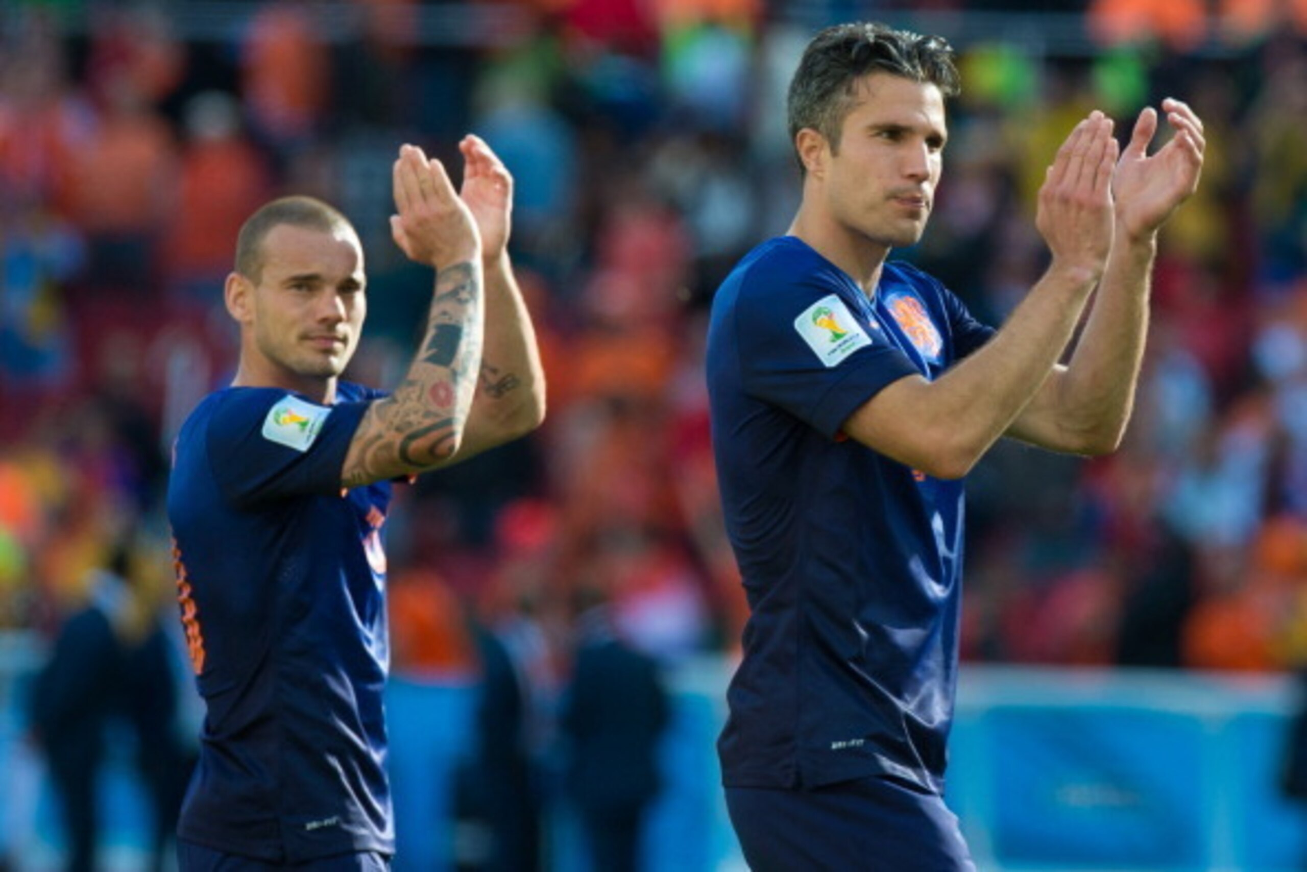 PORTO ALEGRE, BRAZIL - JUNE 18: Wesley Sneijder and Robin Van Persie of the Netherlands acknowledge the fans after the 2014 FIFA World Cup Brazil Group B match between Australia and Netherlands at Estadio Beira-Rio on June 18, 2014 in Porto Alegre, Brazil