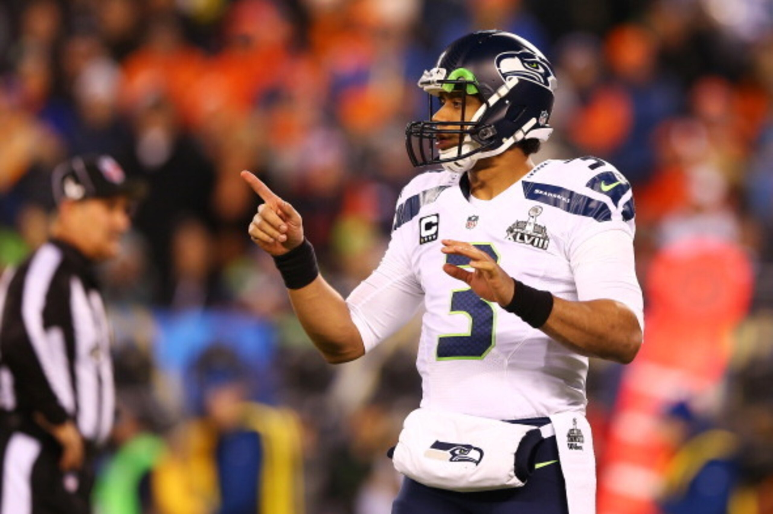 EAST RUTHERFORD, NJ - FEBRUARY 02:  Quarterback Russell Wilson #3 of the Seattle Seahawks calls a play during the second half of Super Bowl XLVIII against the Denver Broncos  at MetLife Stadium on February 2, 2014 in East Rutherford, New Jersey.  (Photo b
