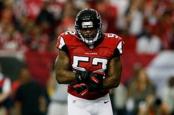 ATLANTA, GA - JANUARY 13:  Akeem Dent #52 of the Atlanta Falcons celebrates stopping  Marshawn Lynch #24 of the Seattle Seahawks in the first quarter of the NFC Divisional Playoff Game at Georgia Dome on January 13, 2013 in Atlanta, Georgia.  (Photo by Ke