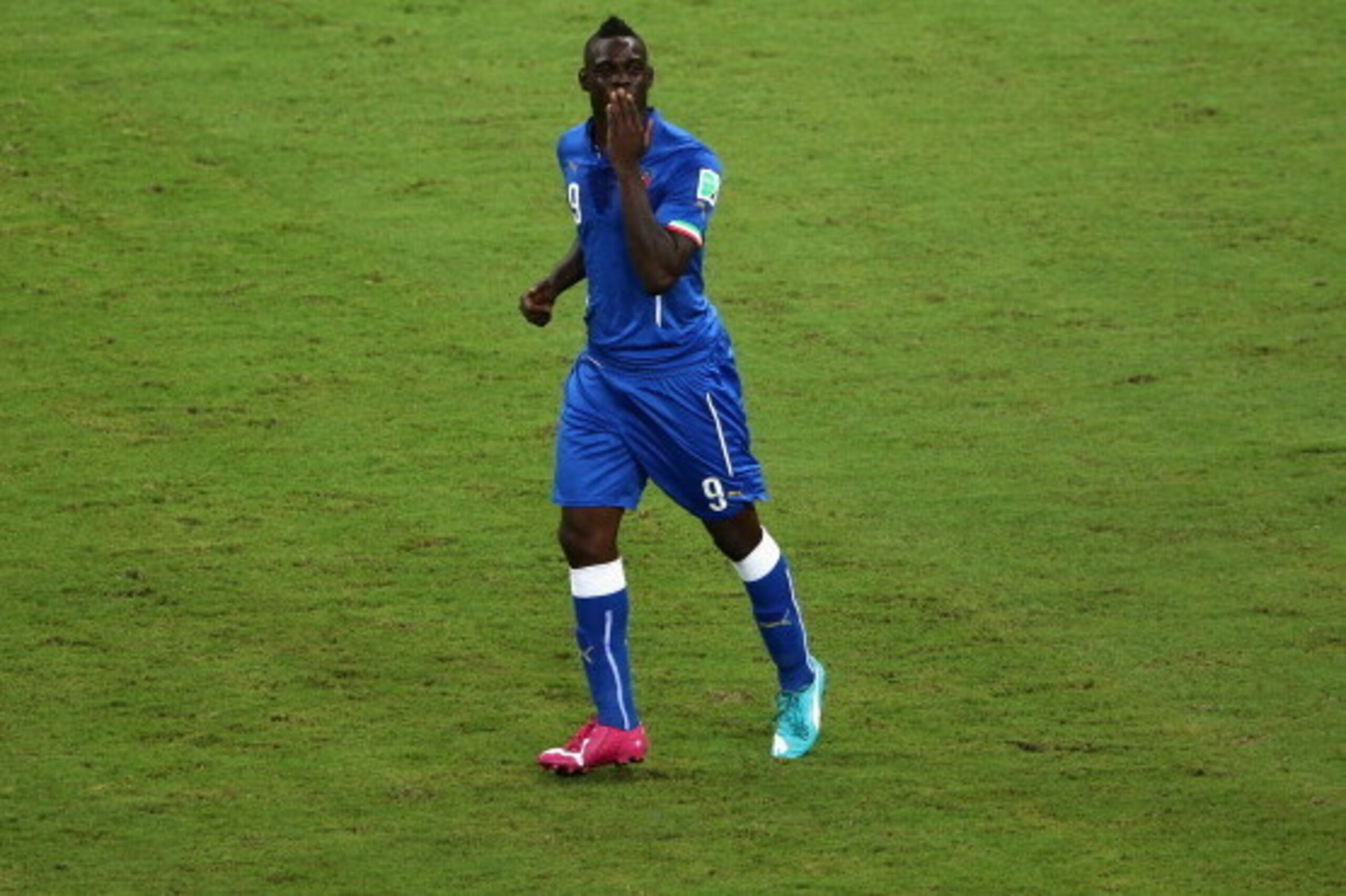 MANAUS, BRAZIL - JUNE 14:  Mario Balotelli of Italy celebrates after scoring Italy's second goal during the 2014 FIFA World Cup Brazil Group D match between England and Italy at Arena Amazonia on June 14, 2014 in Manaus, Brazil.  (Photo by Warren Little/G