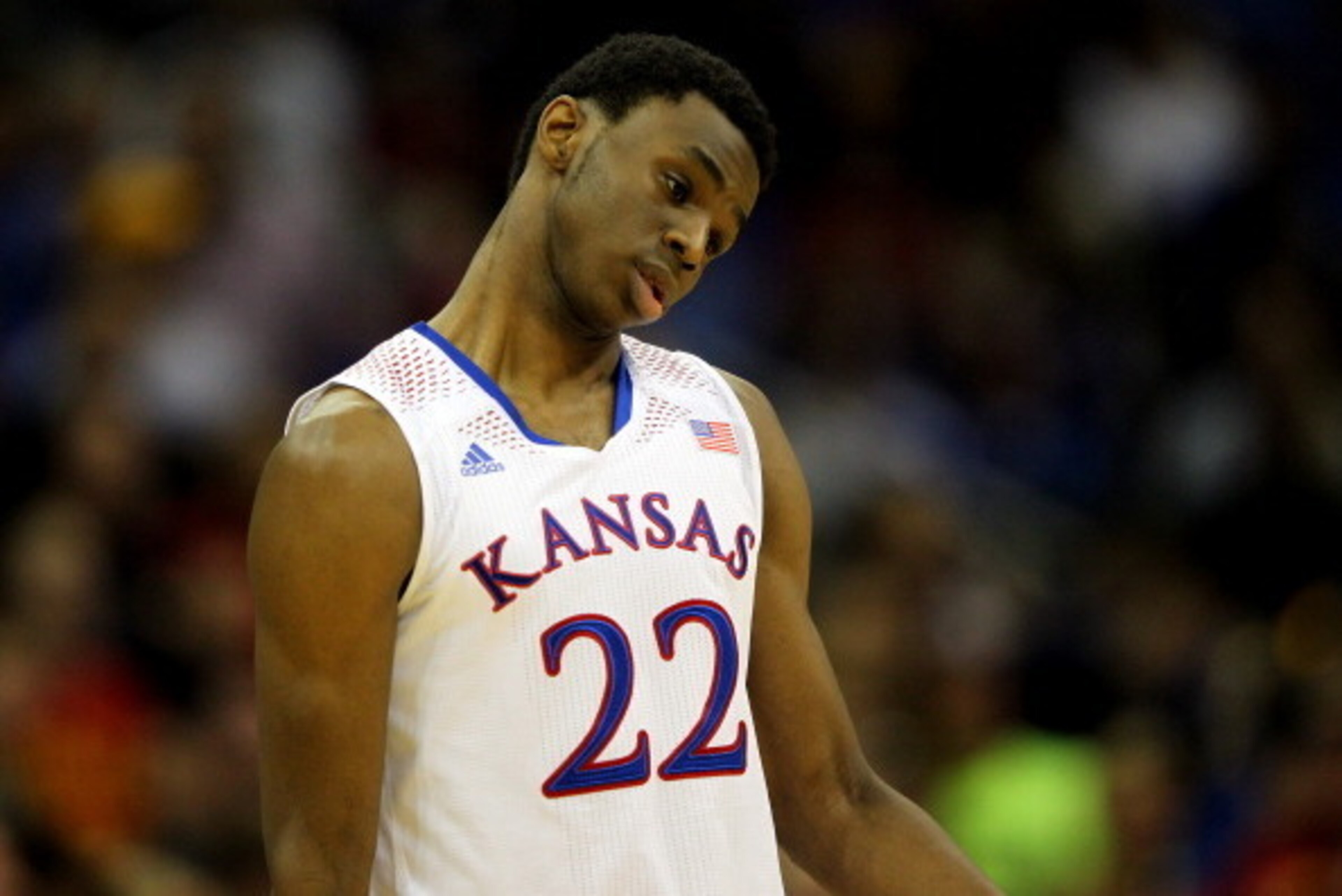 KANSAS CITY, MO - MARCH 14:  Andrew Wiggins #22 of the Kansas Jayhawks walks off the court after the Jayhawks were deated by the Iowa State Cyclones in the Big 12 Basketball Tournament semifinal game at Sprint Center on March 14, 2014 in Kansas City, Miss