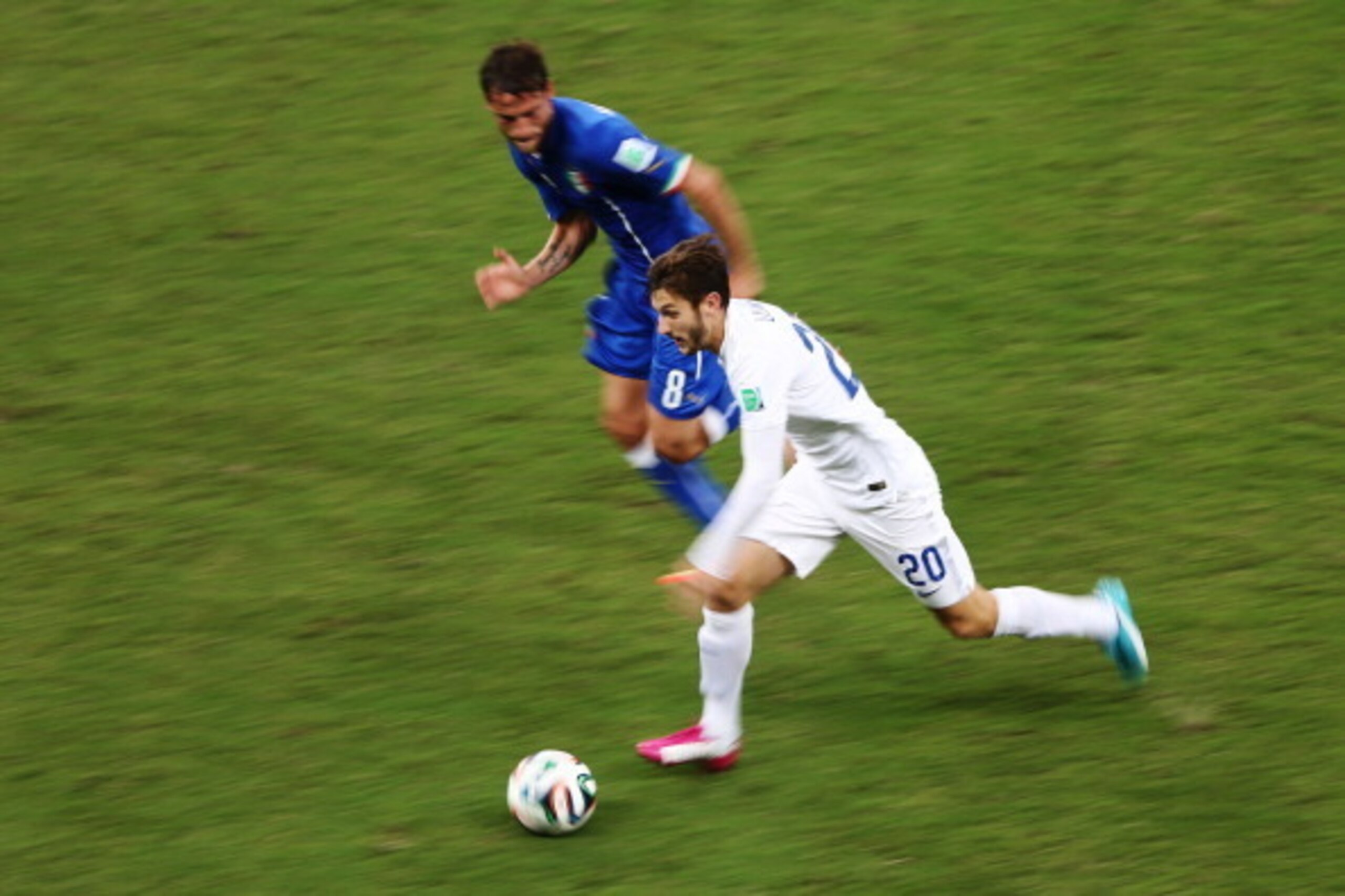 MANAUS, BRAZIL - JUNE 14:  Adam Lallana of England controls the ball as Claudio Marchisio of Italy gives chase during the 2014 FIFA World Cup Brazil Group D match between England and Italy at Arena Amazonia on June 14, 2014 in Manaus, Brazil.  (Photo by W