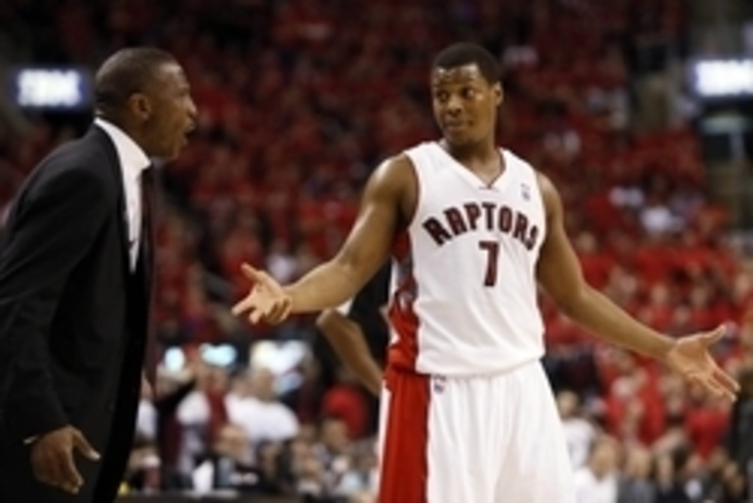 May 4, 2014; Toronto, Ontario, CAN; Toronto Raptors head coach Dwane Casey  and Toronto Raptors guard Kyle Lowry (7) reacts after a call in game seven of the first round of the 2014 NBA Playoffs against the Brooklyn Nets at the Air Canada Centre. Brooklyn
