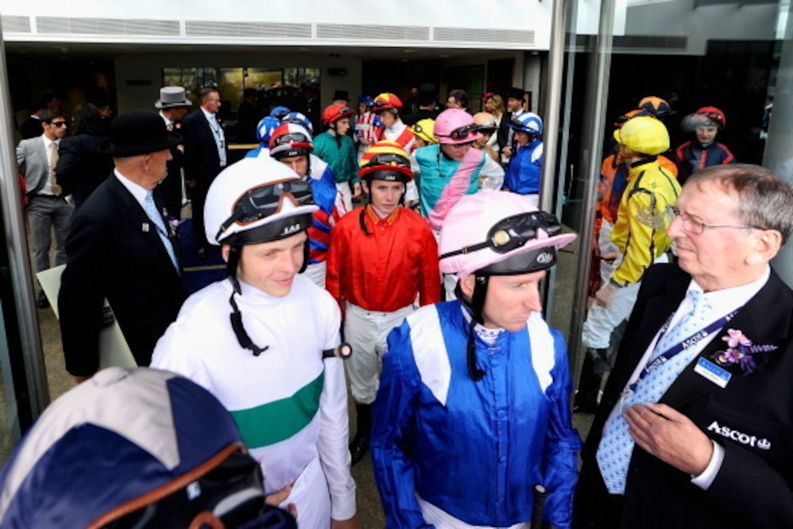 ASCOT, ENGLAND - JUNE 19:  Jockeys make their way to the parade ring during day three of Royal Ascot at Ascot Racecourse on June 19, 2014 in Ascot, England.  (Photo by Alan Crowhurst/Getty Images for Ascot Racecourse)