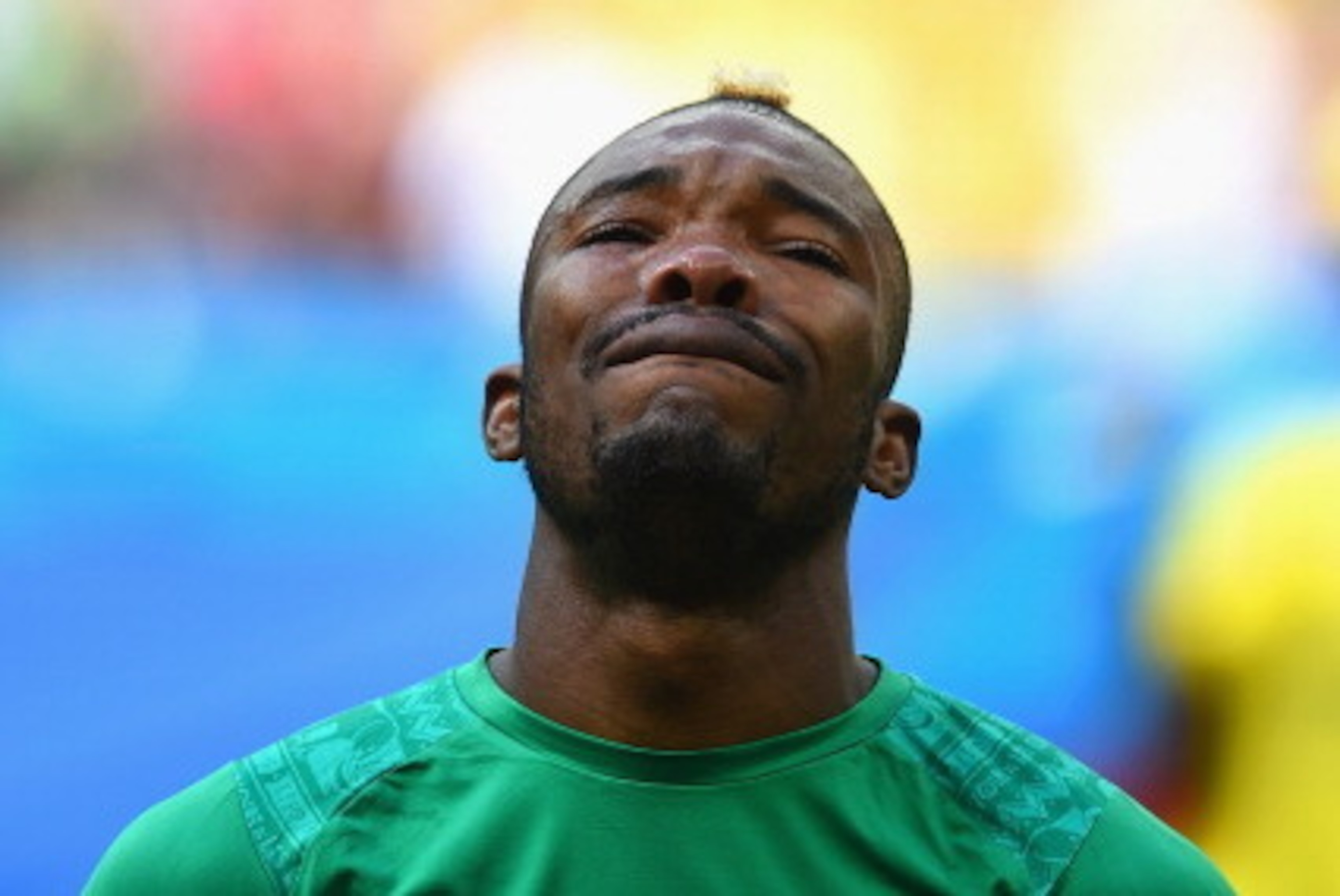 BRASILIA, BRAZIL - JUNE 19: Die Serey of the Ivory Coast gets emotional during his National Anthem during the 2014 FIFA World Cup Brazil Group C match between Colombia and Cote D'Ivoire at Estadio Nacional on June 19, 2014 in Brasilia, Brazil.  (Photo by