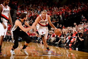 PORTLAND, OR - MAY 10: Nicolas Batum #88 of the Portland Trail Blazers drives against the San Antonio Spurs in Game Three of the Western Conference Semifinals on May 10, 2014 at the Moda Center in Portland, Oregon. NOTE TO USER: User expressly acknowledge