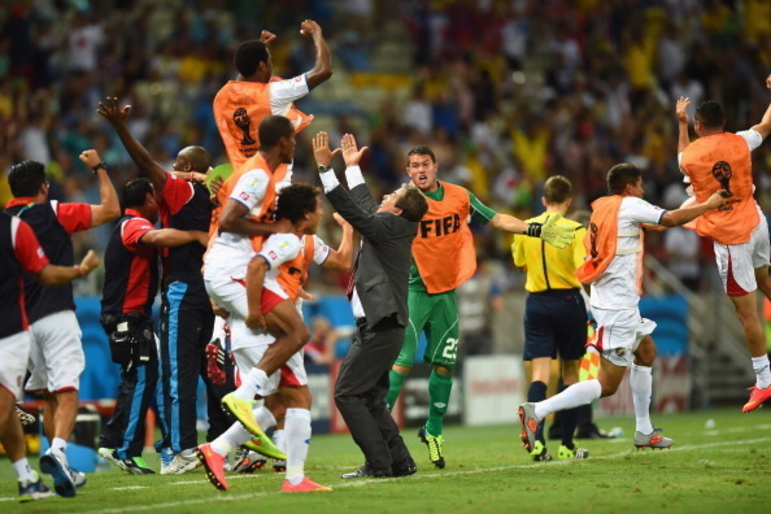 FORTALEZA, BRAZIL - JUNE 14:  Costa Rica players celebrate with head coach Jorge Luis Pinto after their teams third goal  during the 2014 FIFA World Cup Brazil Group D match between Uruguay and Costa Rica  at Castelao on June 14, 2014 in Fortaleza, Brazil